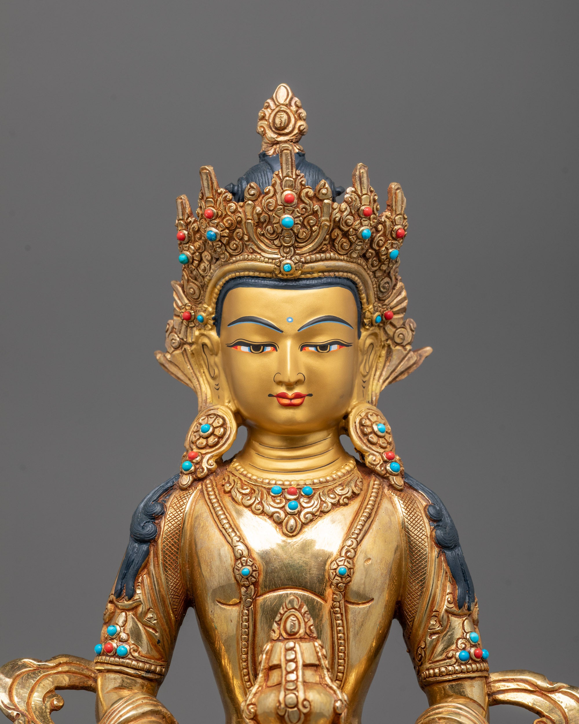 Close-up view of Amitayus Statue showing detailed 24k gold fire gilding on Copper Based