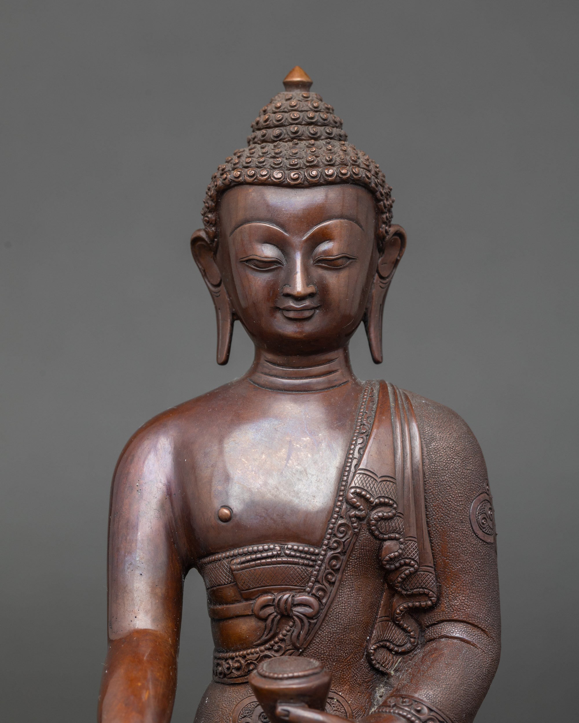 Close-up view of Shakyamuni Buddha face, serene expression, meditation and mindfulness statue