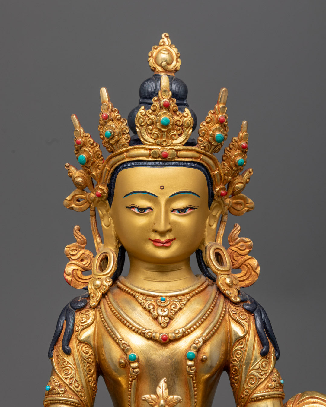 Amitayus Statue showcasing the gold fire-gilded body and intricately crafted face made from precious stones.