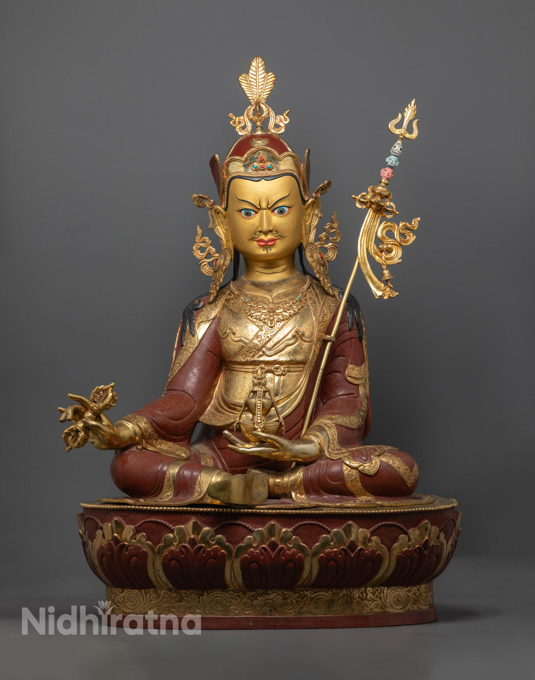 Guru Rinpoche (Padmasambhava) Statue highlighting the gold fire gilded body and intricately crafted face made from precious stones.