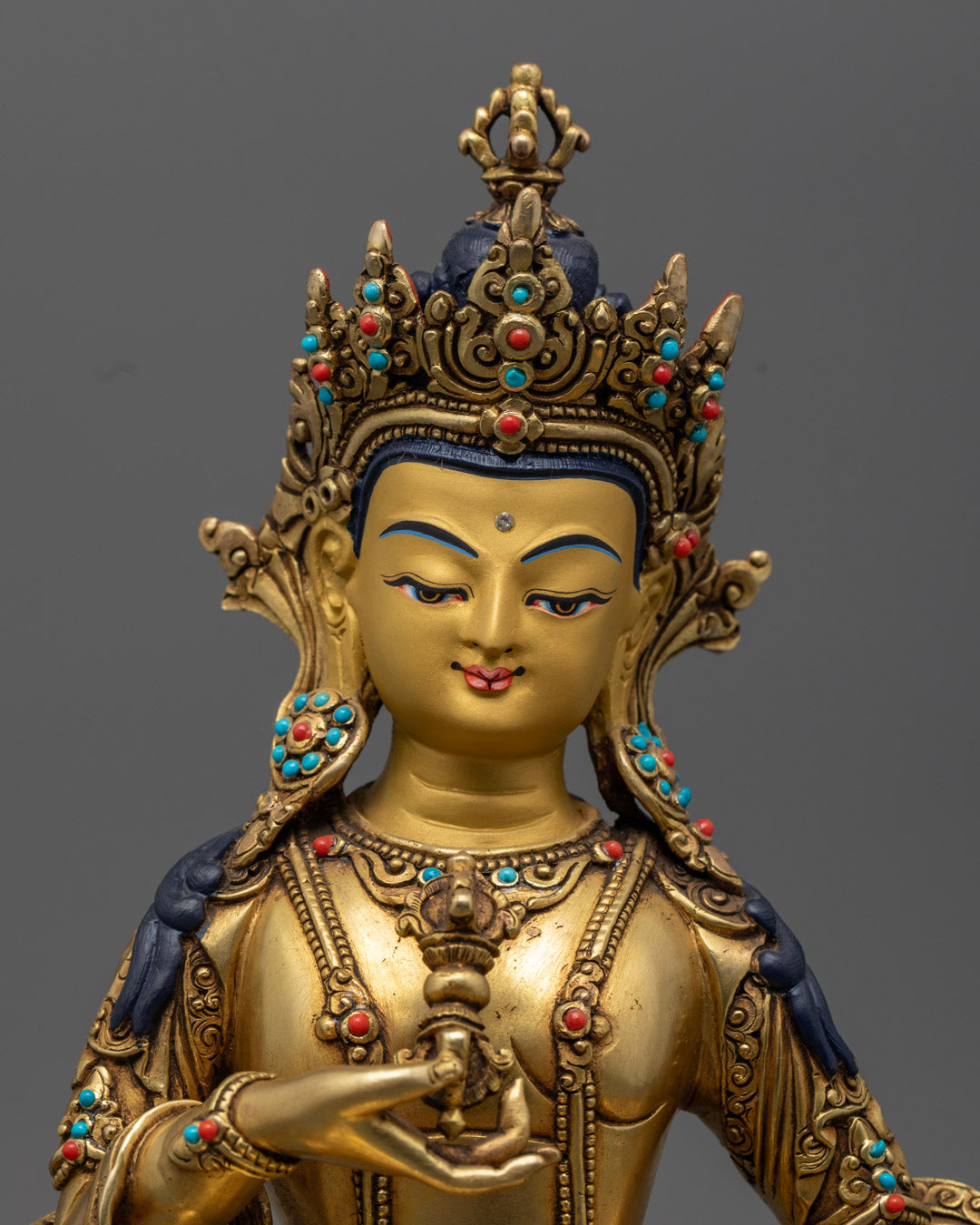 Vajrasattva Statue's detailed gold-plated copper craftsmanship, showcasing sacred Tibetan artistry and divine facial expression.