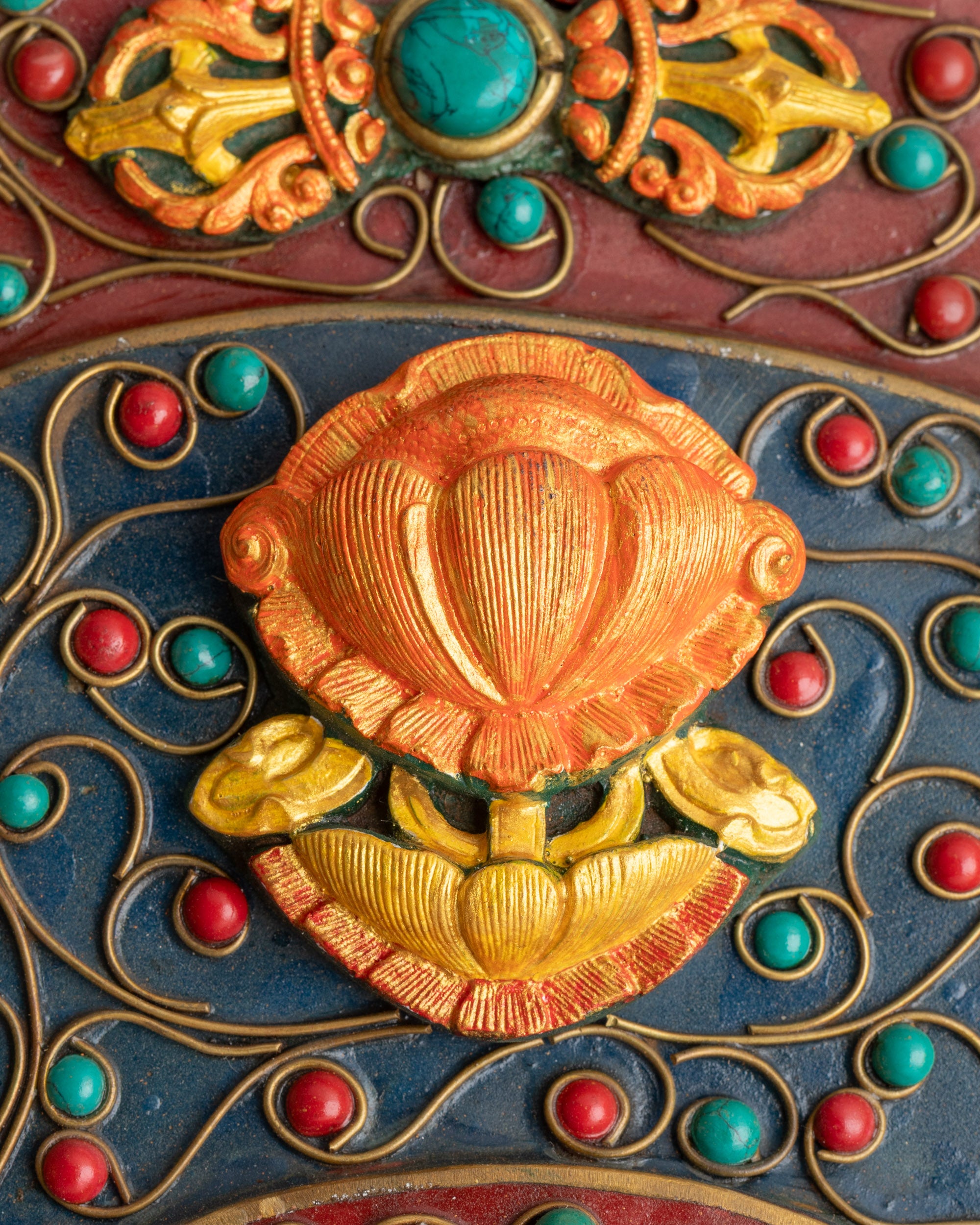 Close up Ashtamangala Lotus symbol with coral stone on copper Mandala wall art