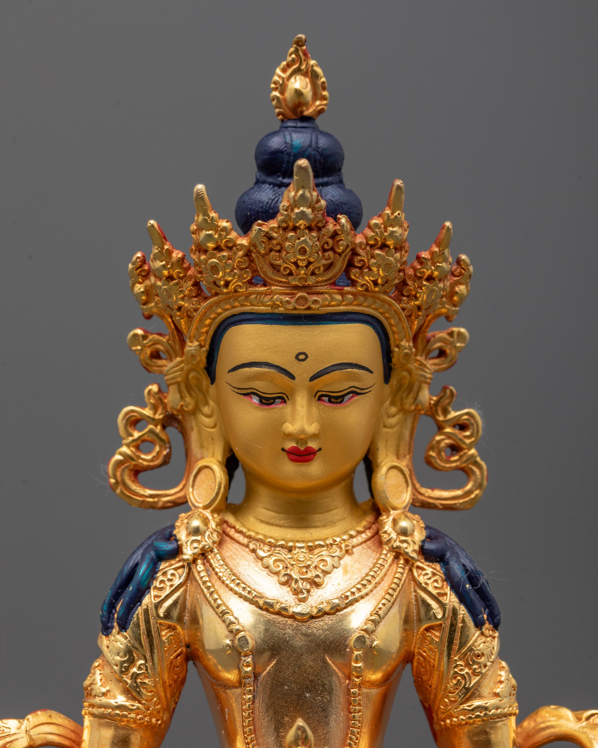 Close up Beautiful Amitayus statue with gold finish crafted in Nepal