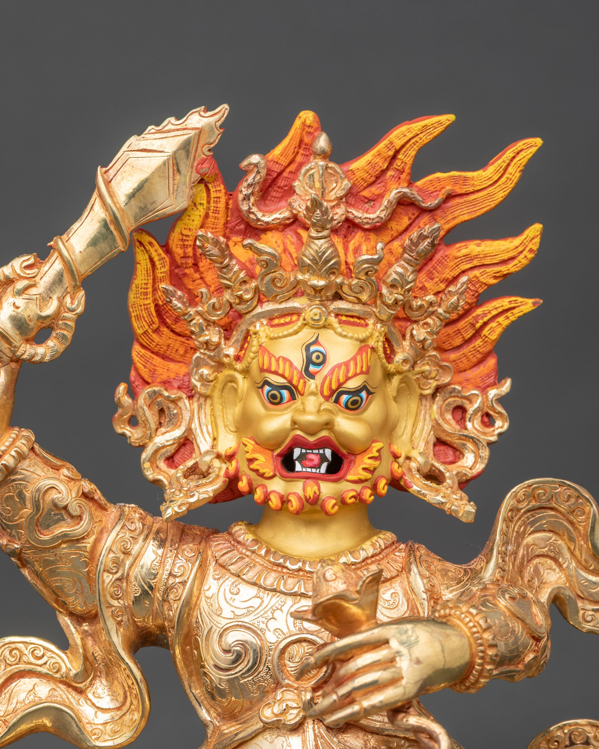 Close up Begtse Chen figure scorpion-handled sword crown of skulls detailed robes
