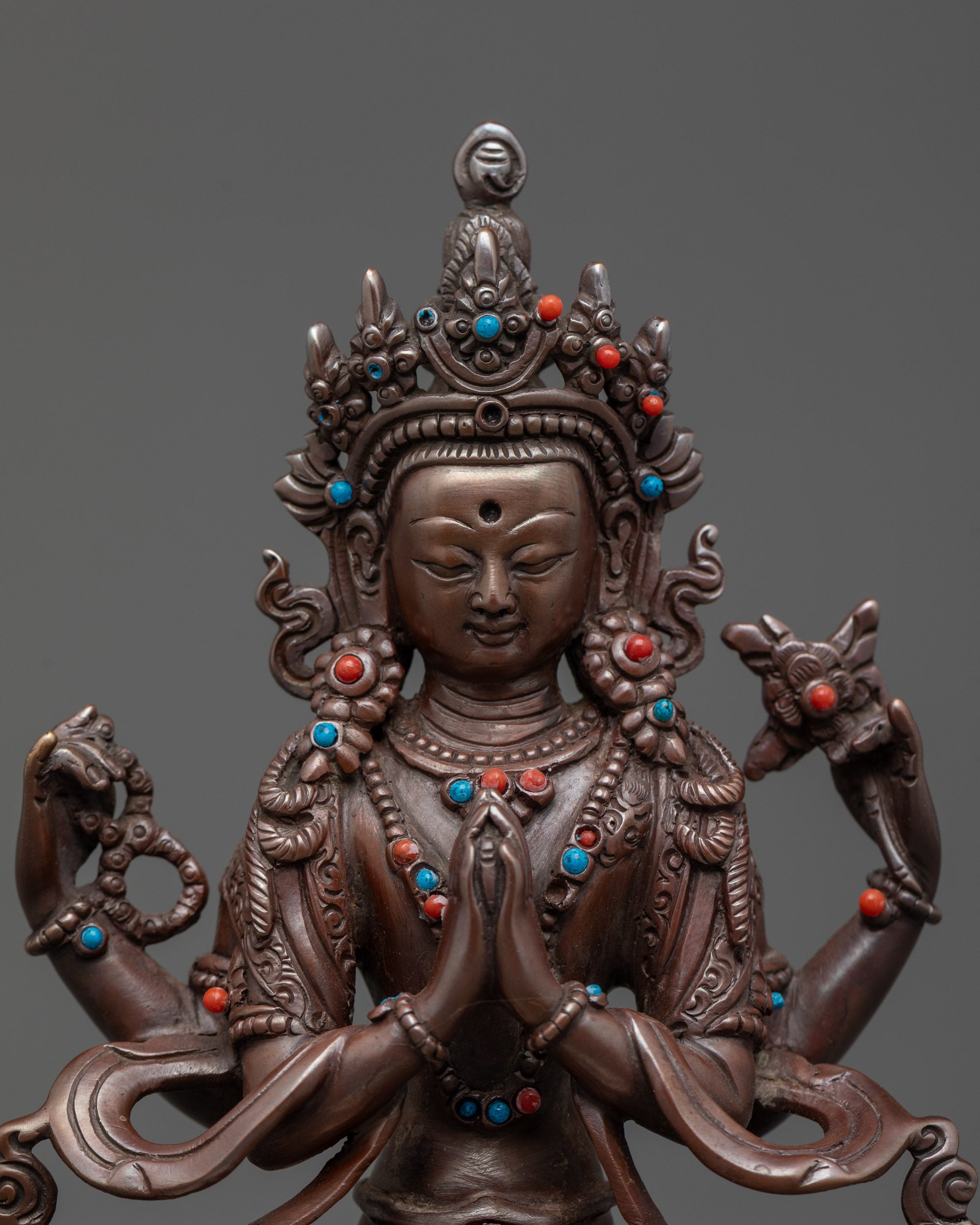 Close up Chenrezig Statue showing semi-precious stones and detailed hands
