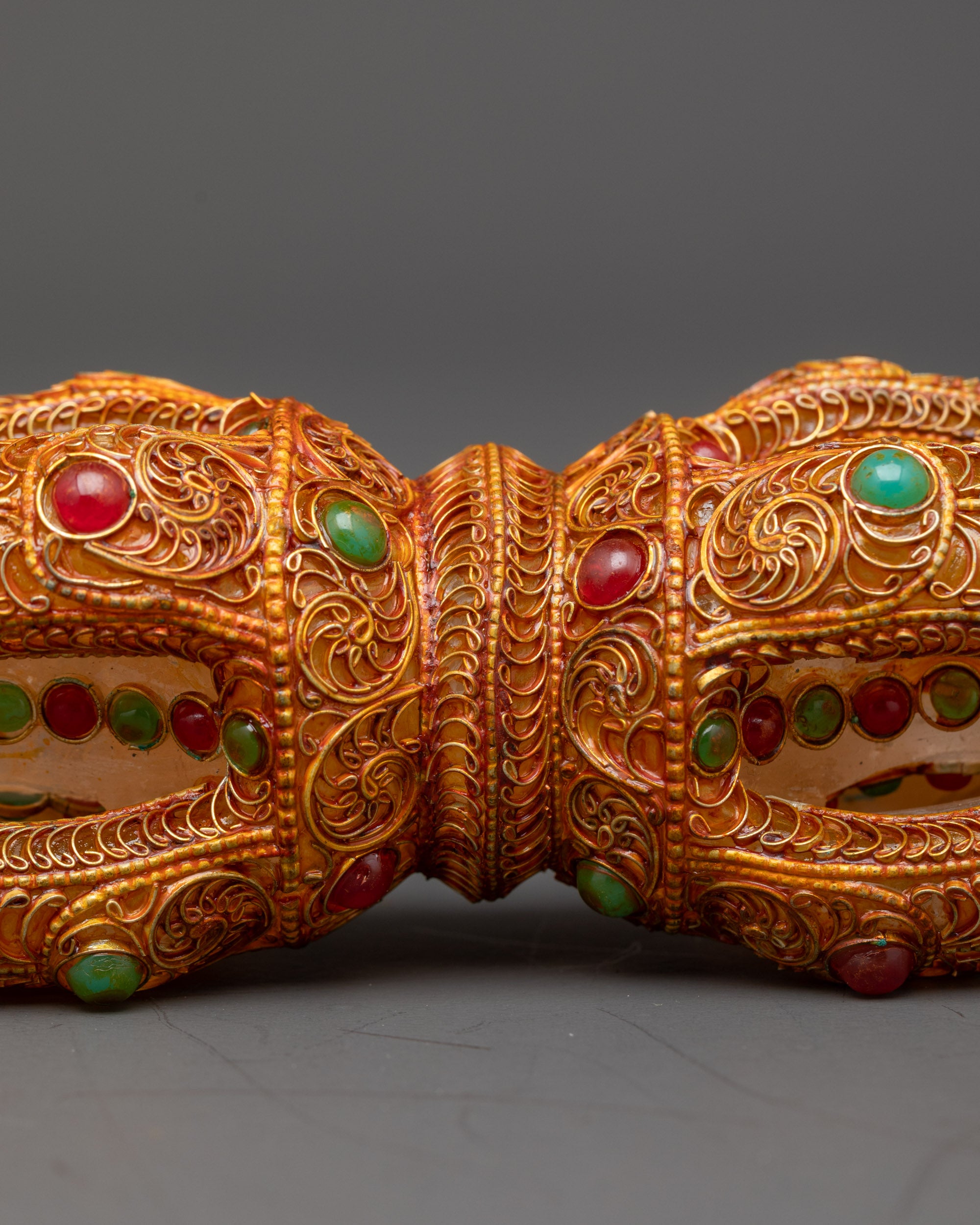 Close up Copper Dorje with crystal core and turquoise ruby stones