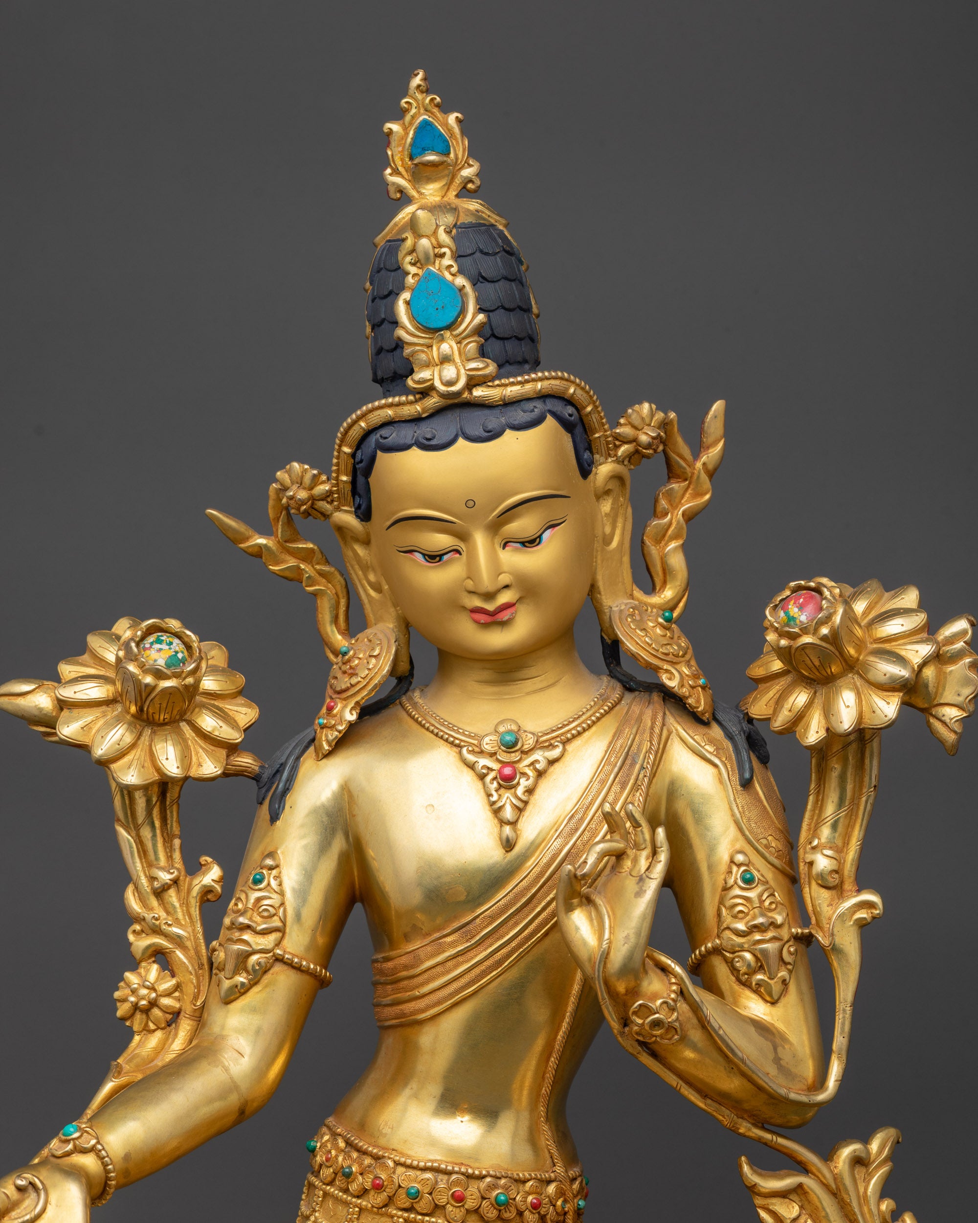 Close up Green Tara Statue Nepalese artisan-crafted with flowing robe and semi-precious stones