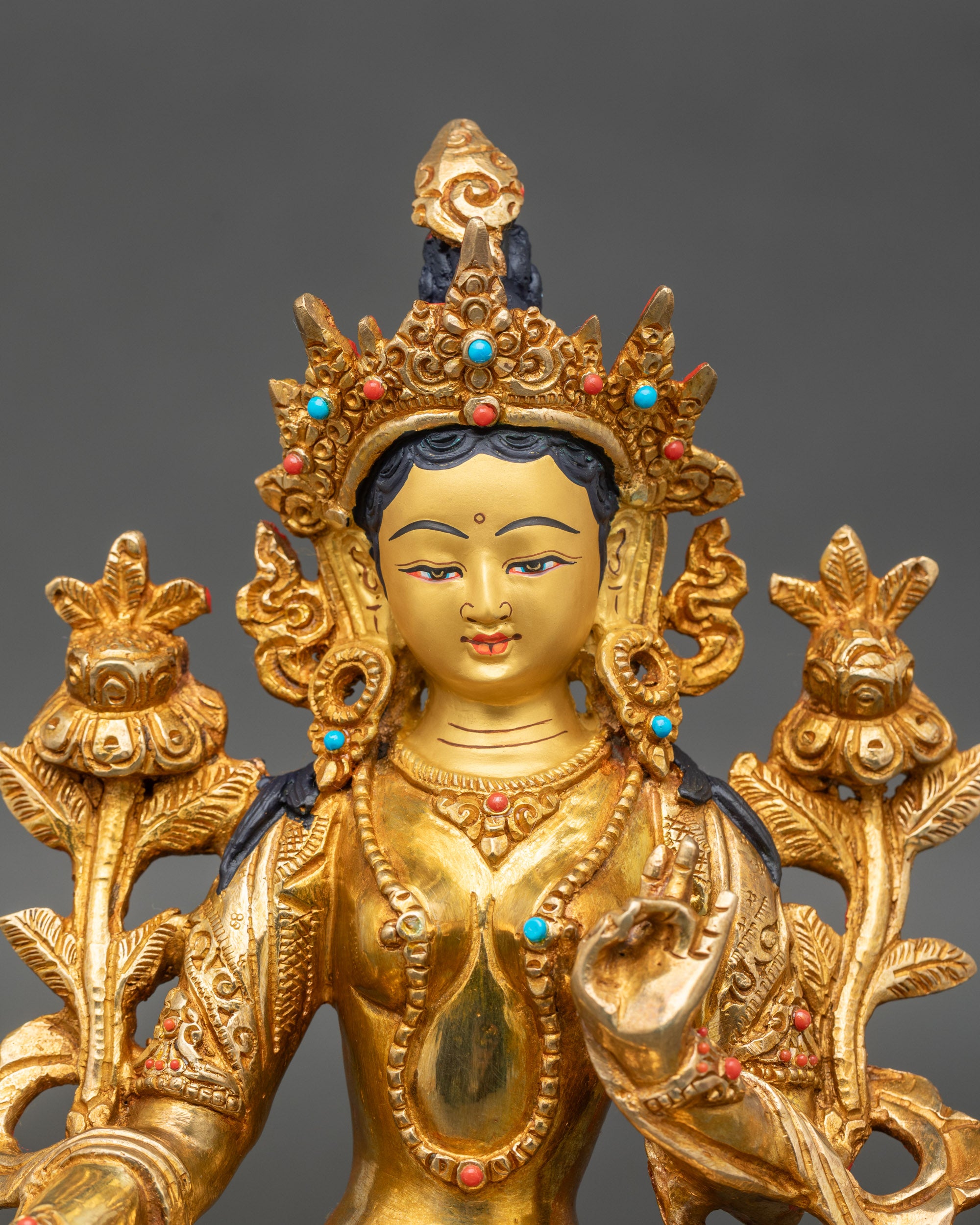 Close up Green Tara face – five-jewelled crown and intricate Newari craftsmanship