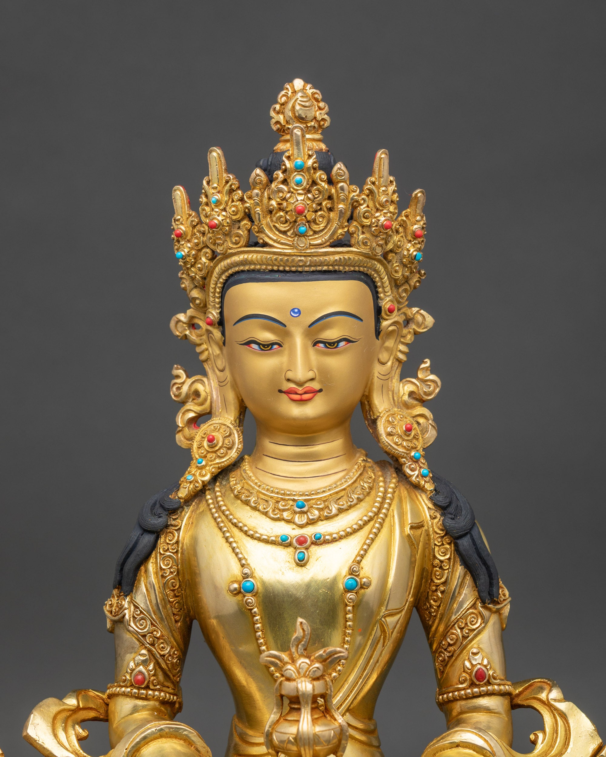 Close up β Handcrafted Newari Amitayus Buddha face with gold-painted details, spiritual art