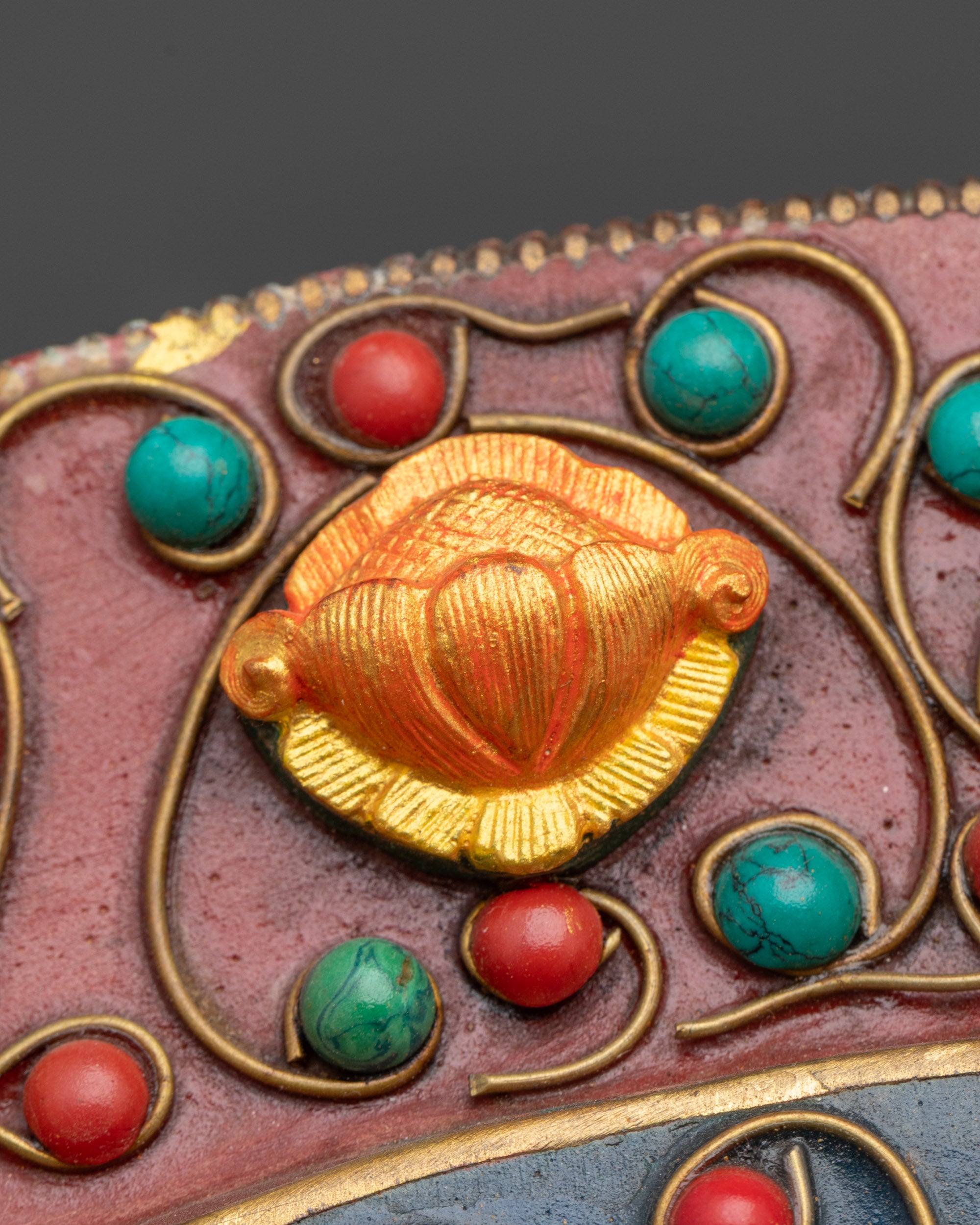 Close up Lotus symbol with coral stone on copper Mandala wall art