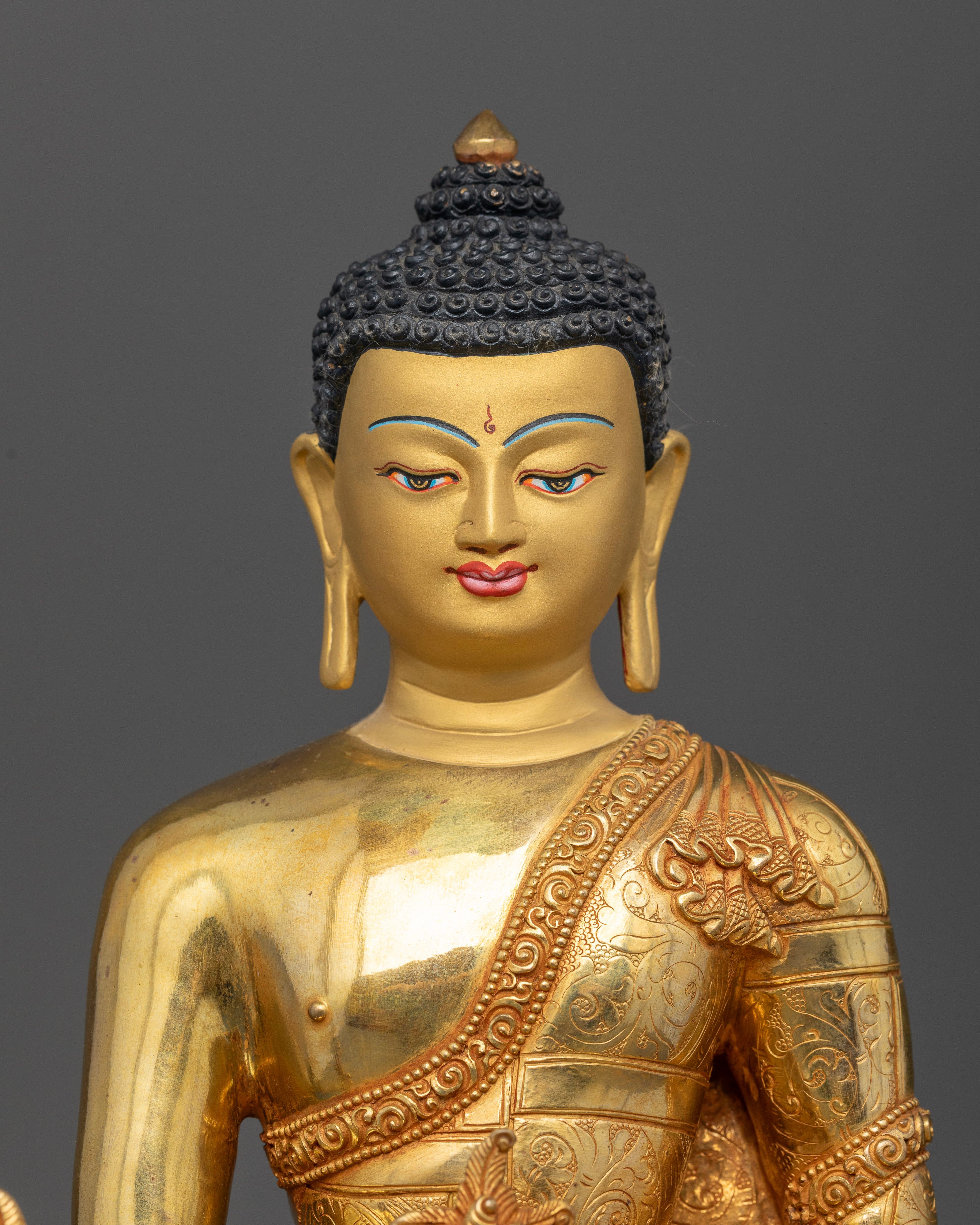 Close up Medicine Buddha sculpture gold-painted face myrobalan vase Himalayan art