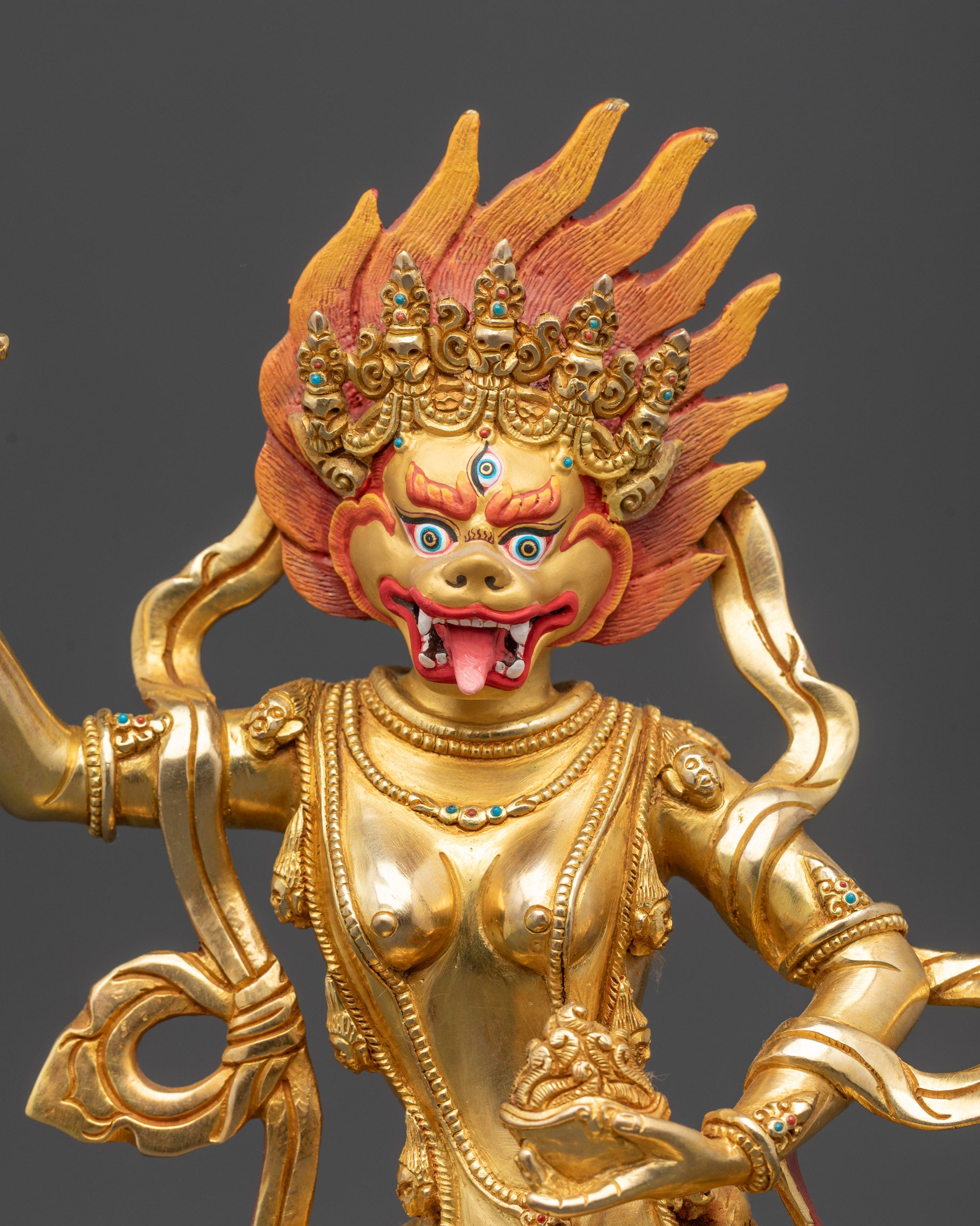 Close up Simhamukha face showing third eye and five-skull crown