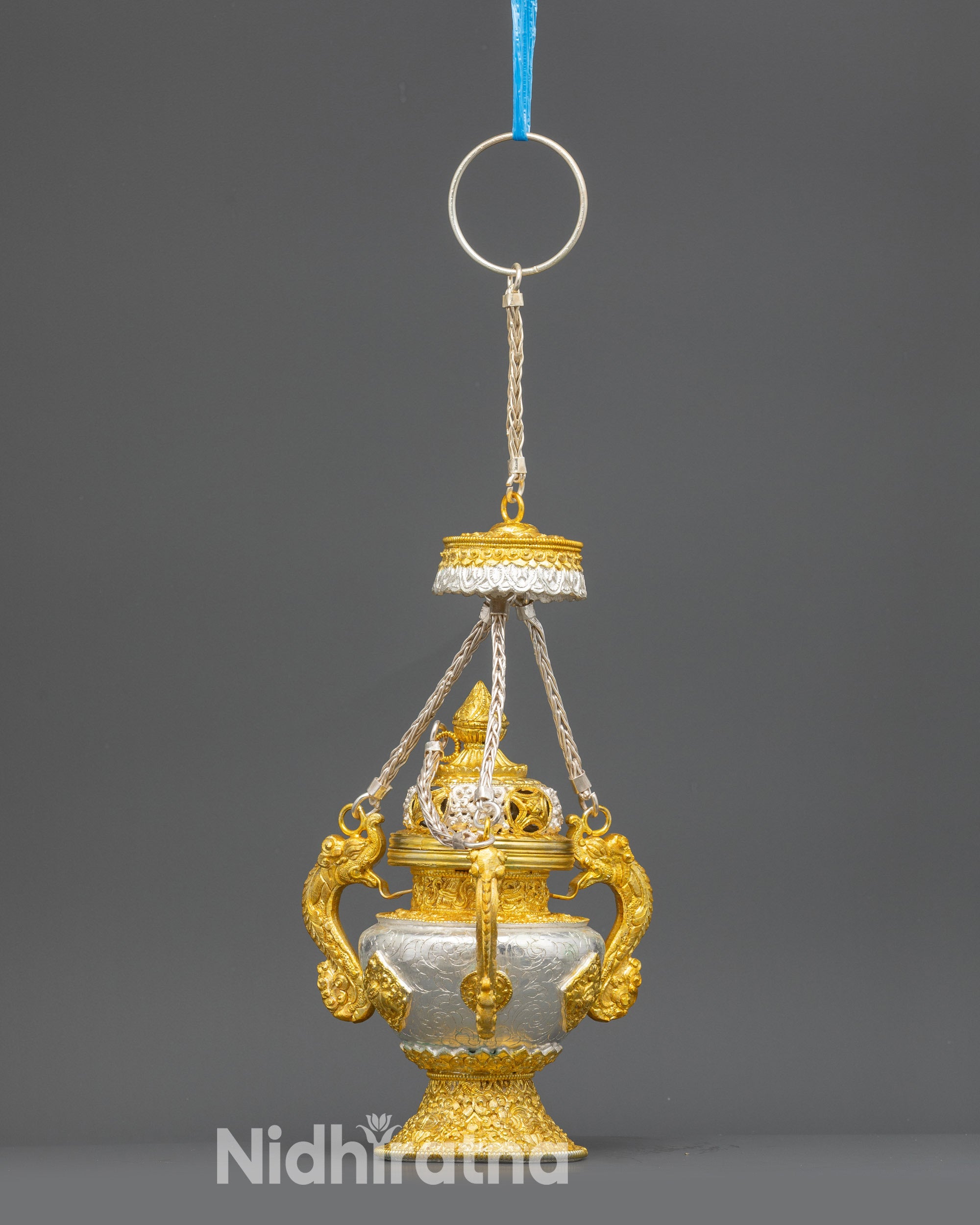 Close up Tibetan Sangbur incense holder filigree pattern and perforated lid detail