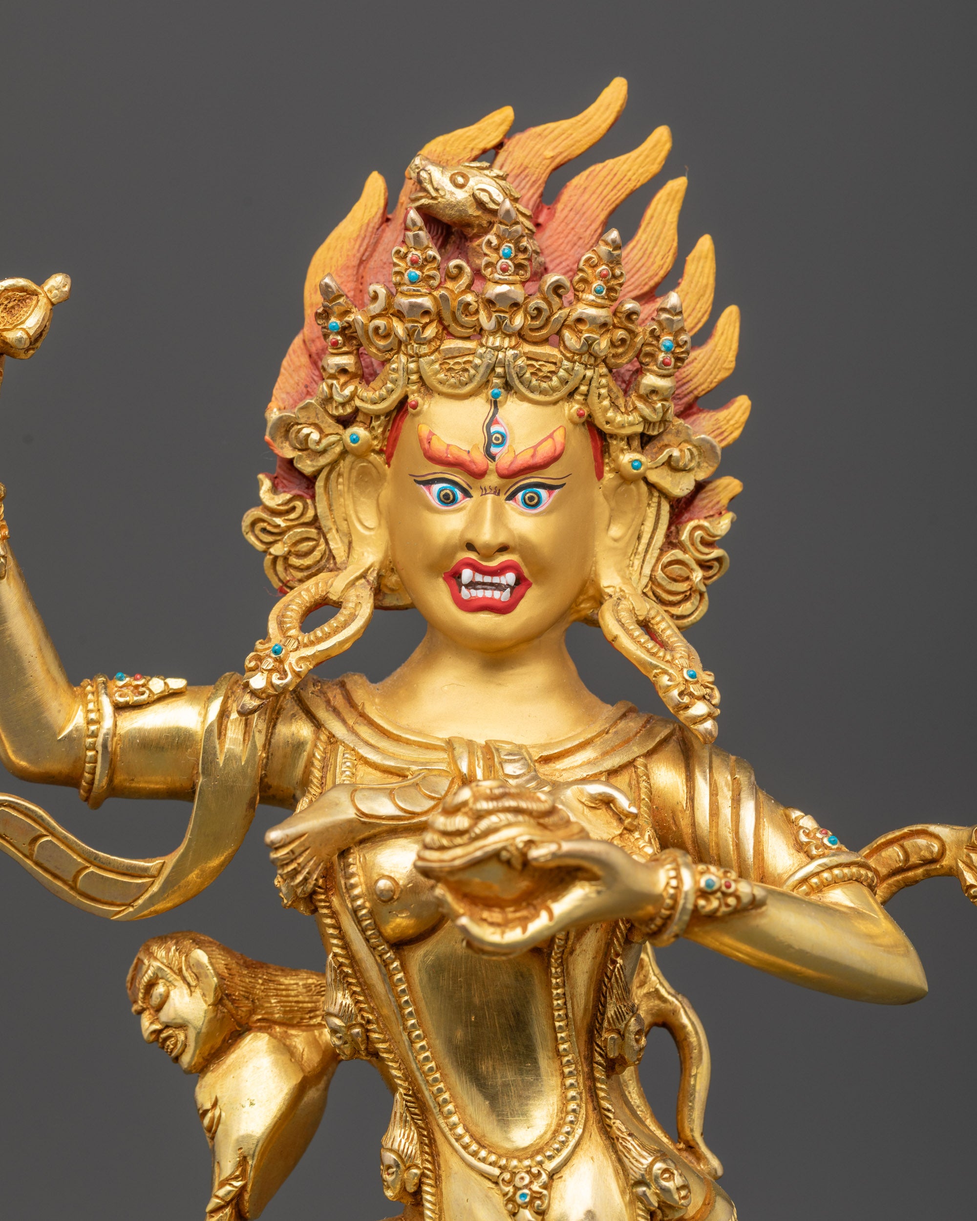 Close up Troma Nangmo face showing third eye, five-skull crown, and skull garland details