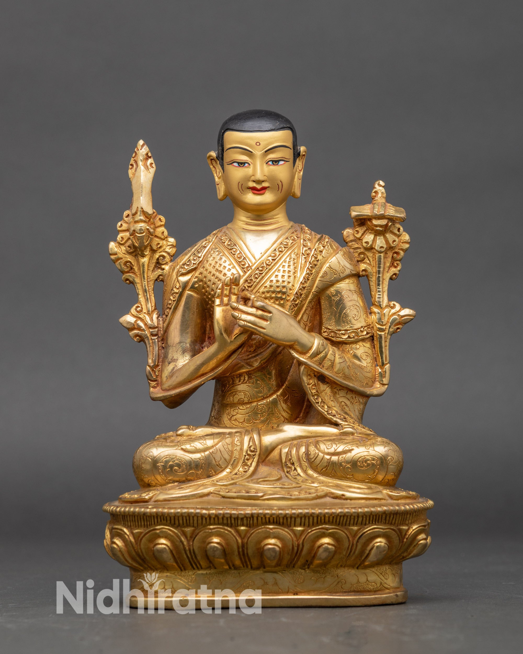 Close up Tsongkhapa figure serene expression intricate robes Himalayan craftsmanship