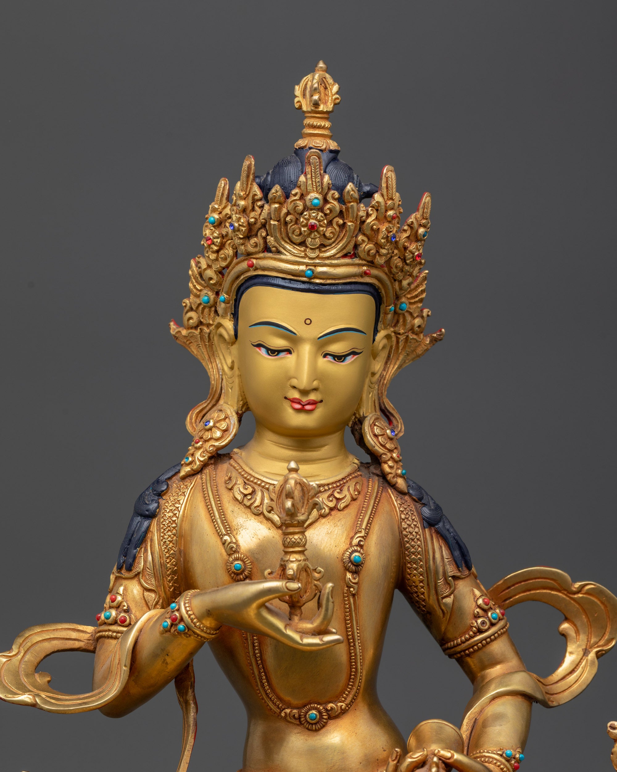 Close up Vajrasattva face showing calm expression and intricate crown details