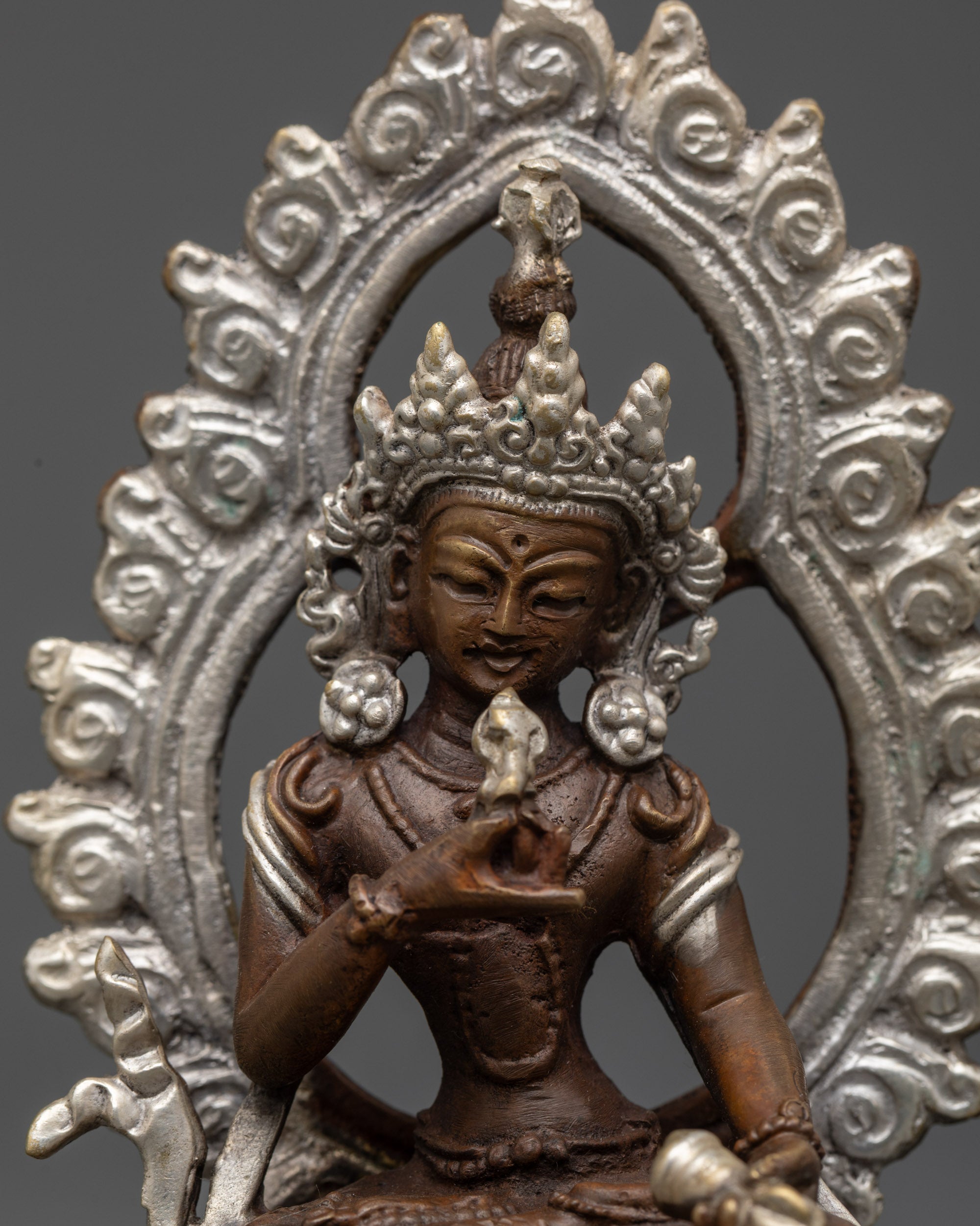 Close up Vajrasattva holding vajra and bell with flowing robes