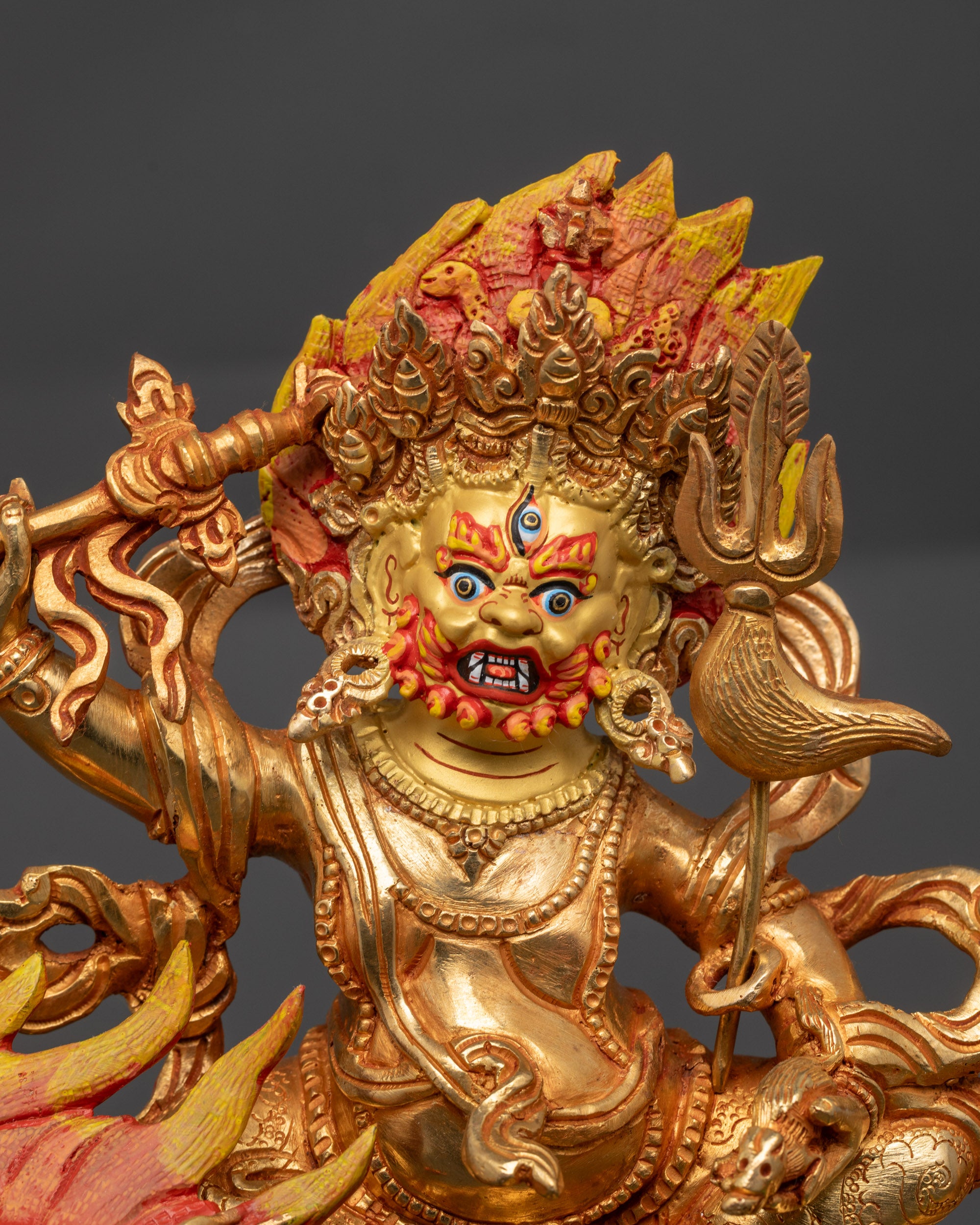 Close up White Dzambhala face with skull crown jewelry and blazing halo details
