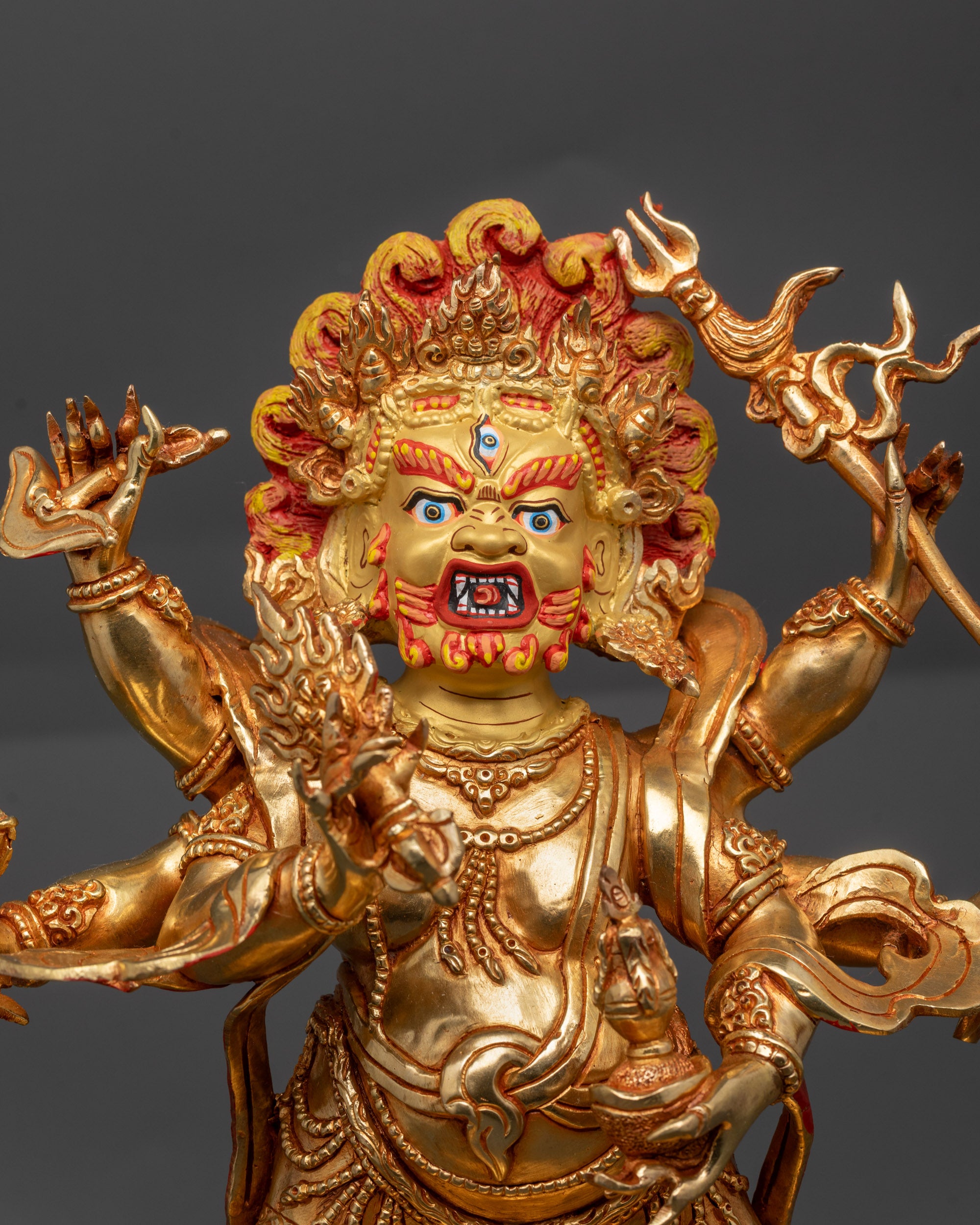 Close up White Mahakala Sculpture showing wrathful face and six-armed deity details