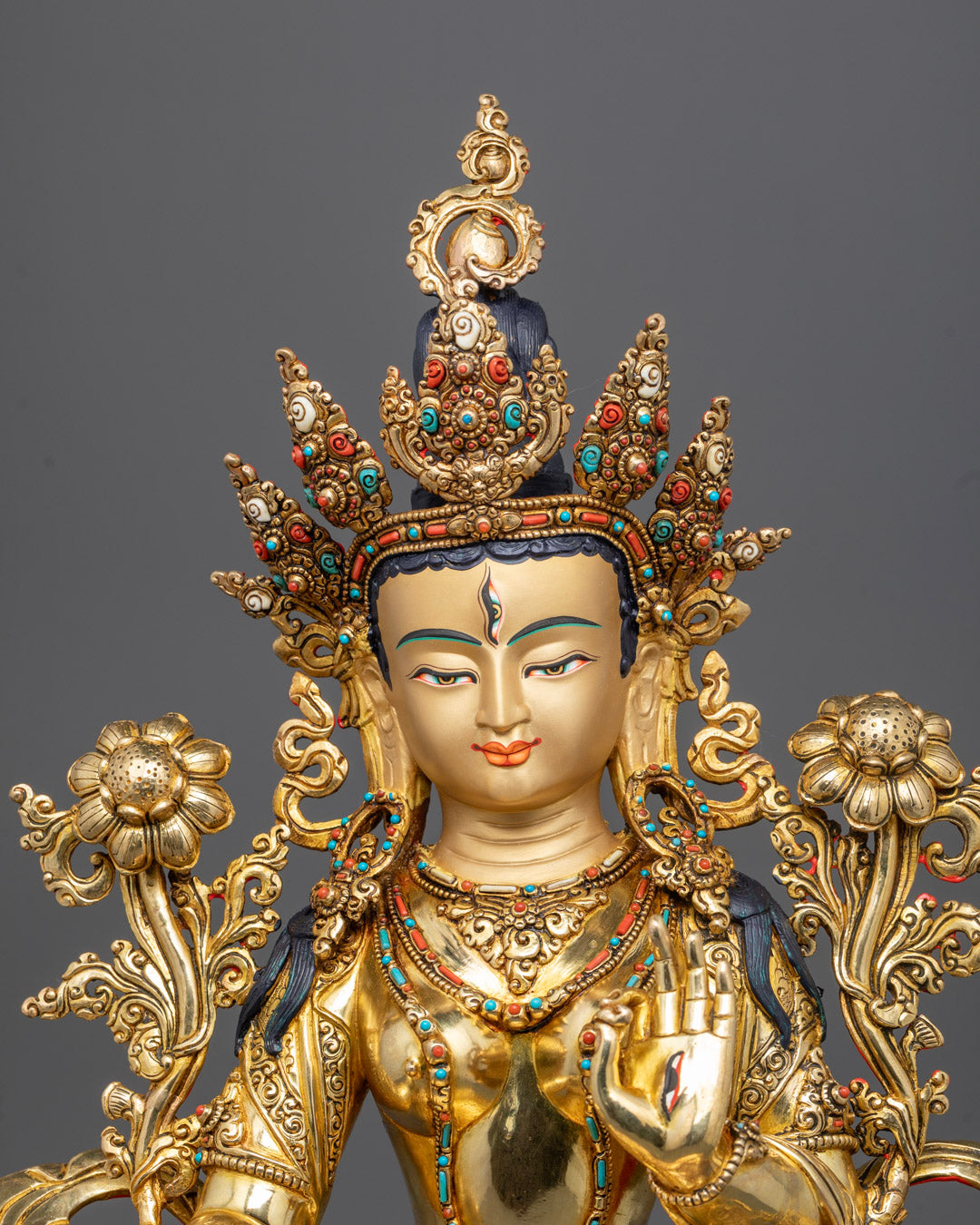 Close up White Tara face with jeweled crown and hand painted details