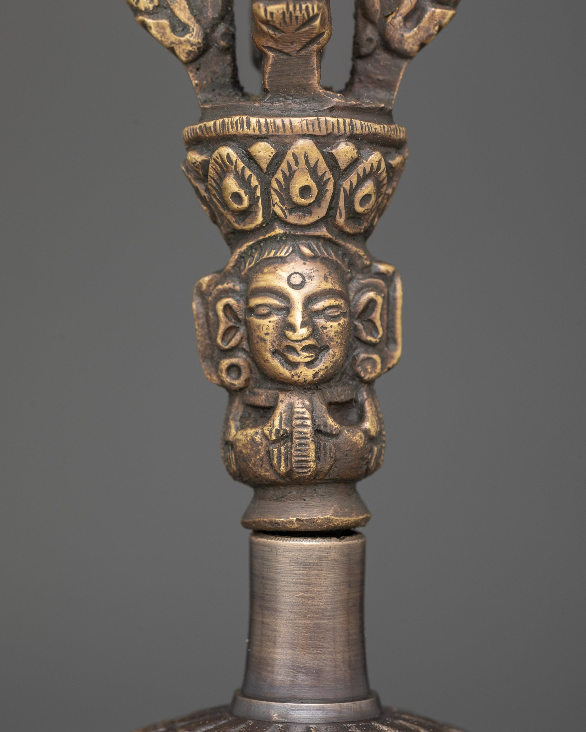 Close up bronze bell with brass deity handle from Himalayan Ghanta Dorje set