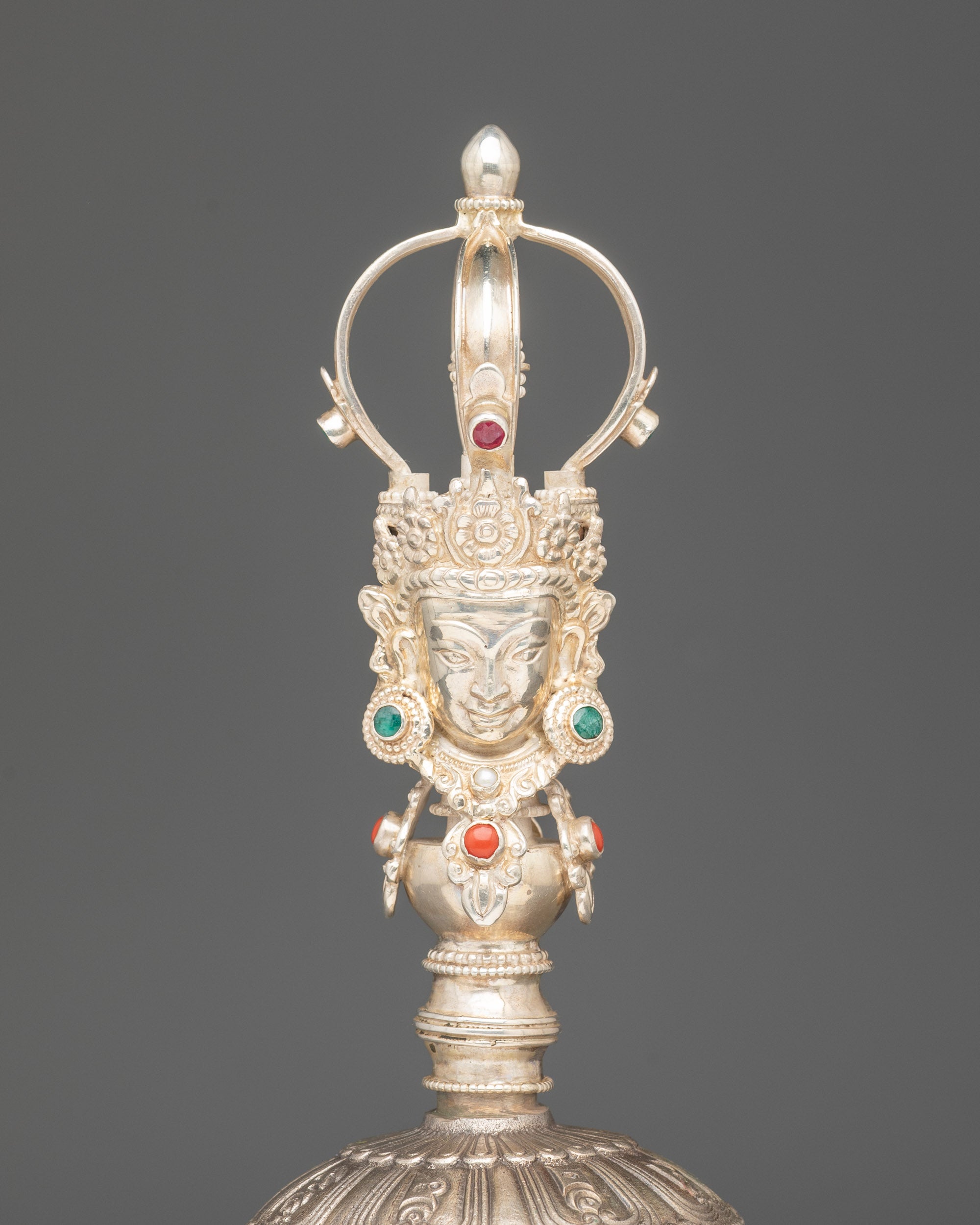 Close up bronze bell with silver handle | Deity carved with five-jewelled crown