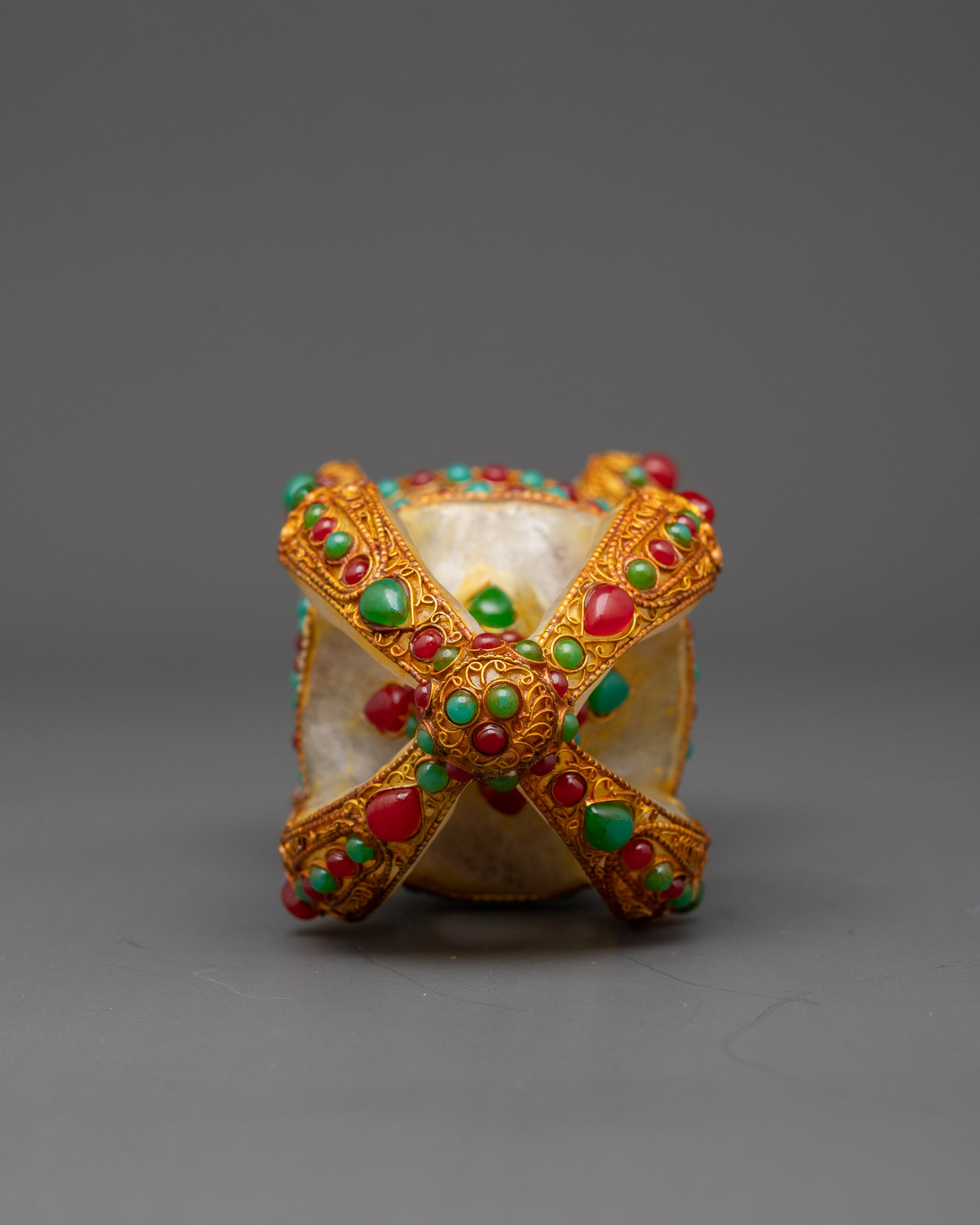 Close up double-ended Vajra showing detailed lotus prongs and ornate central band