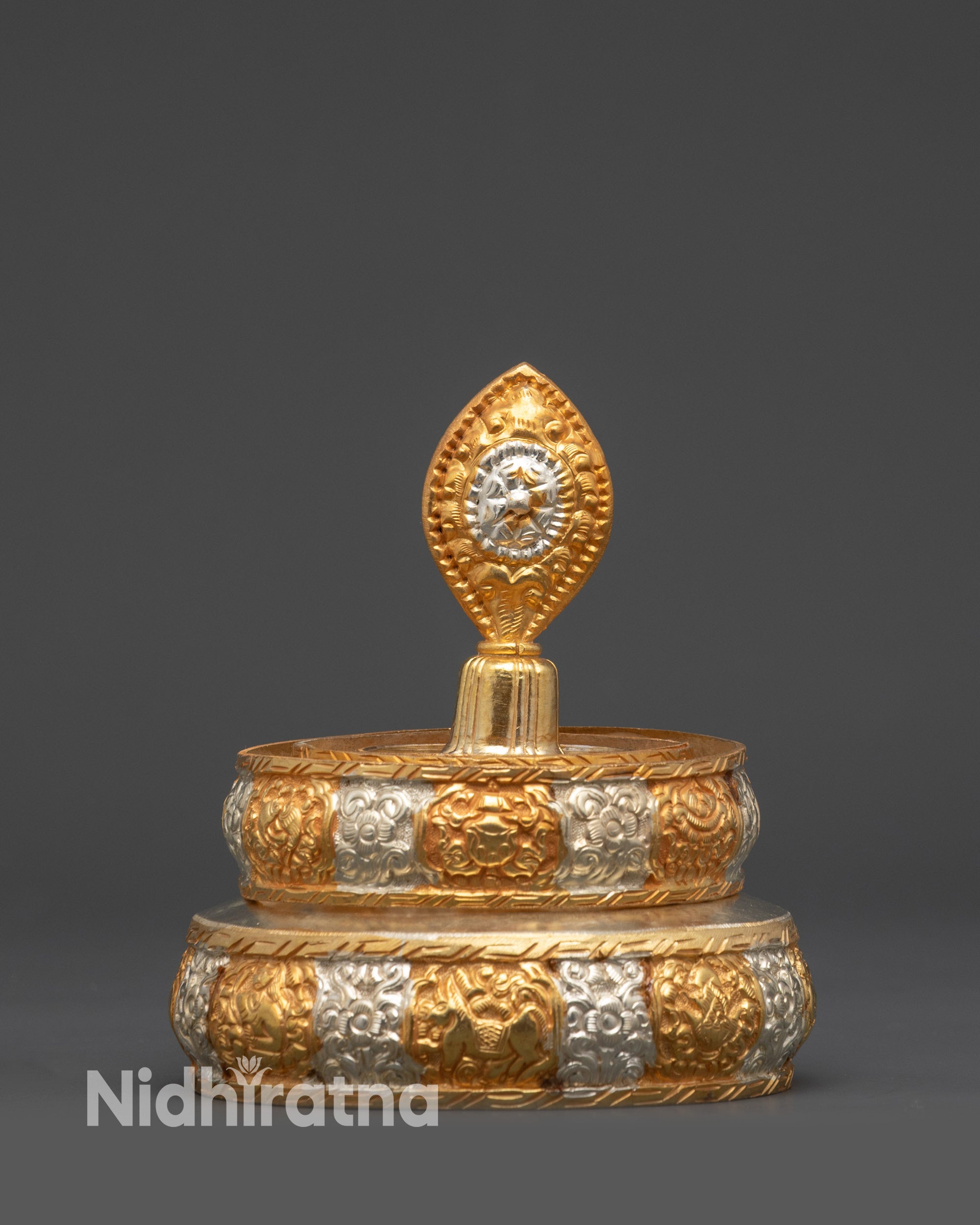 Close up intricate gold and silver-plated filigree Mandala for rituals and offerings