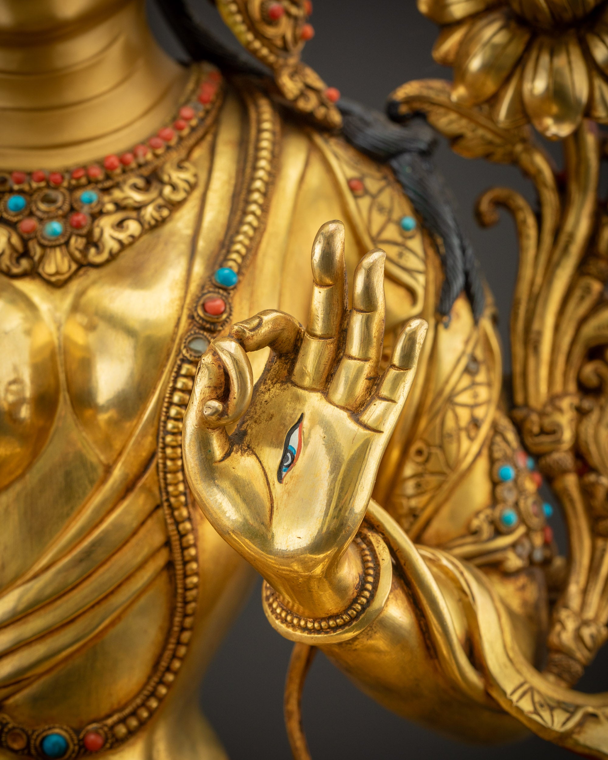 Close up of Abhaya mudra White Tara sculpture left hand teaching wisdom mudra