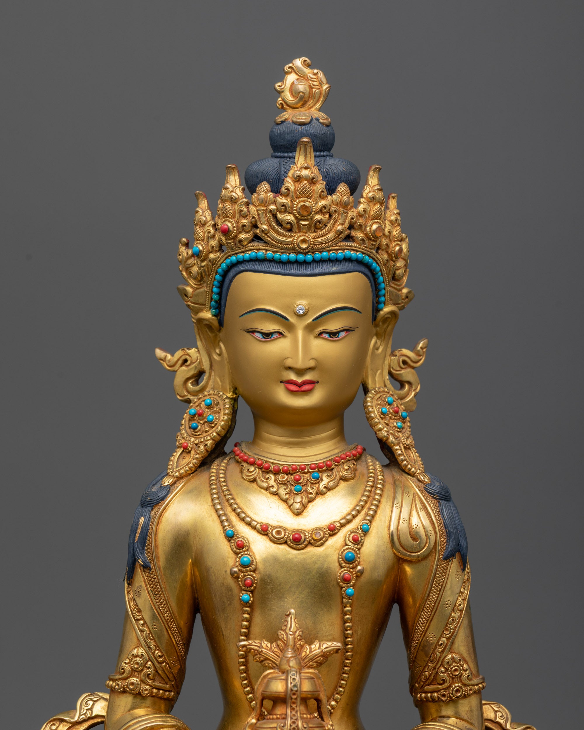 Close up of Amitayus holding nectar vase with intricate robe patterns