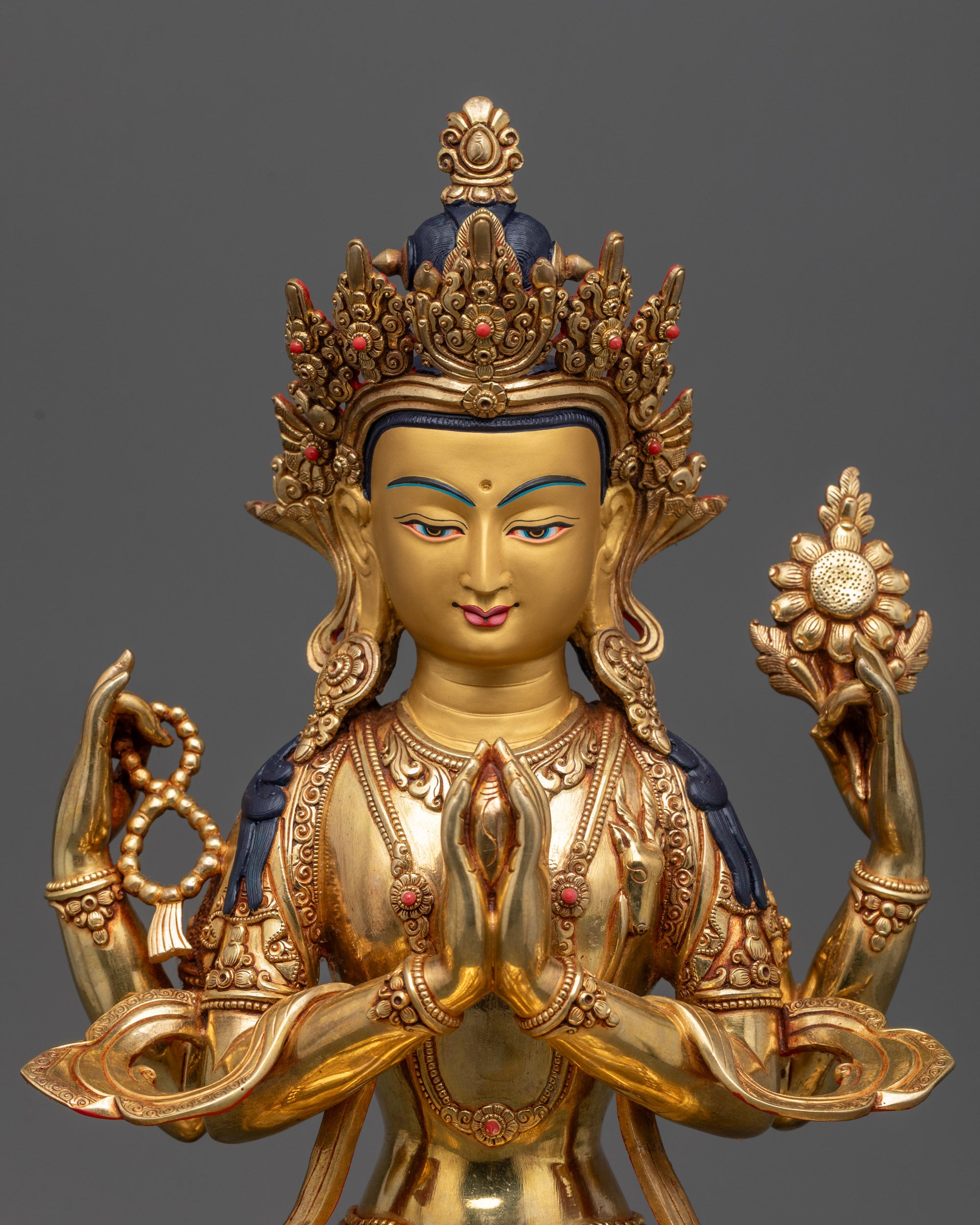 Close up of Chenrezig statue crown and semi-precious jewelry detailing