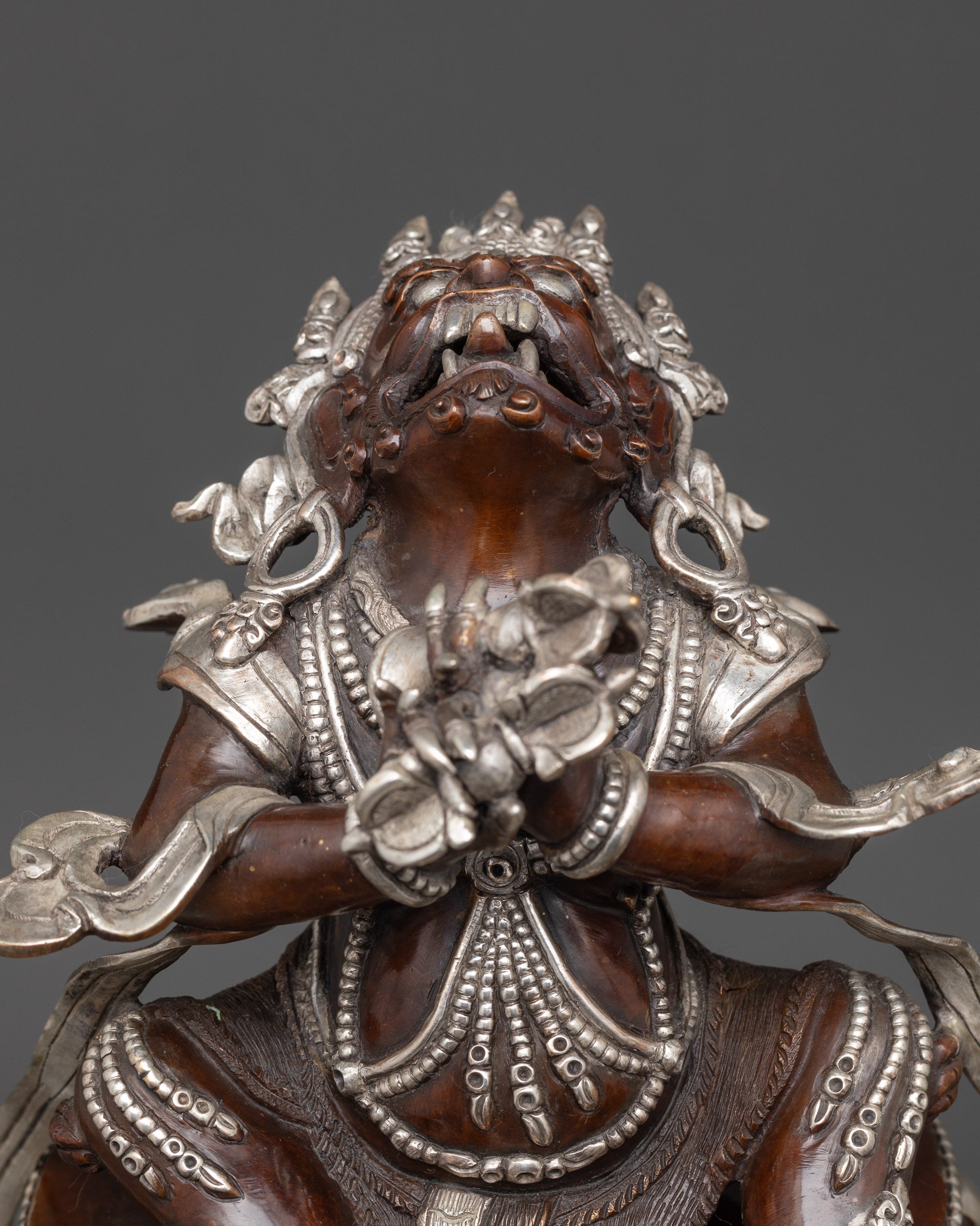 Close up of Dorje Khadro crown and ornate jewelry on silver-plated Vajradhaka Statue