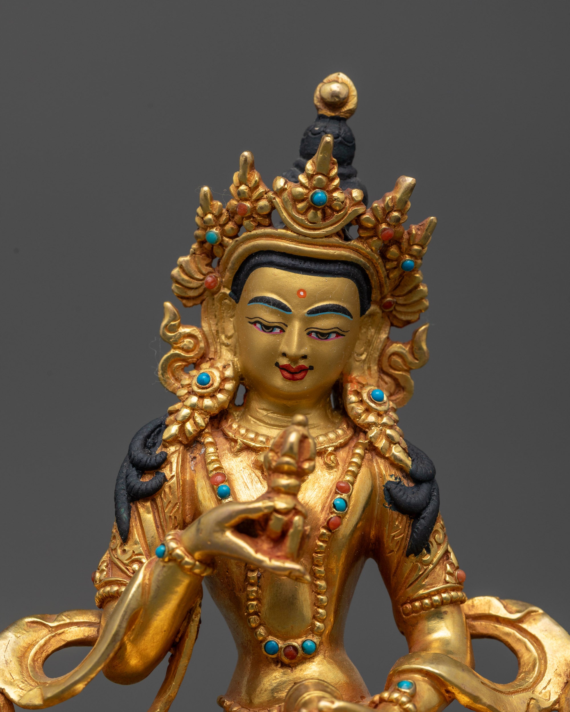Close up of Dorje Sempa Sculpture showing vajra, bell, and intricate jewelry