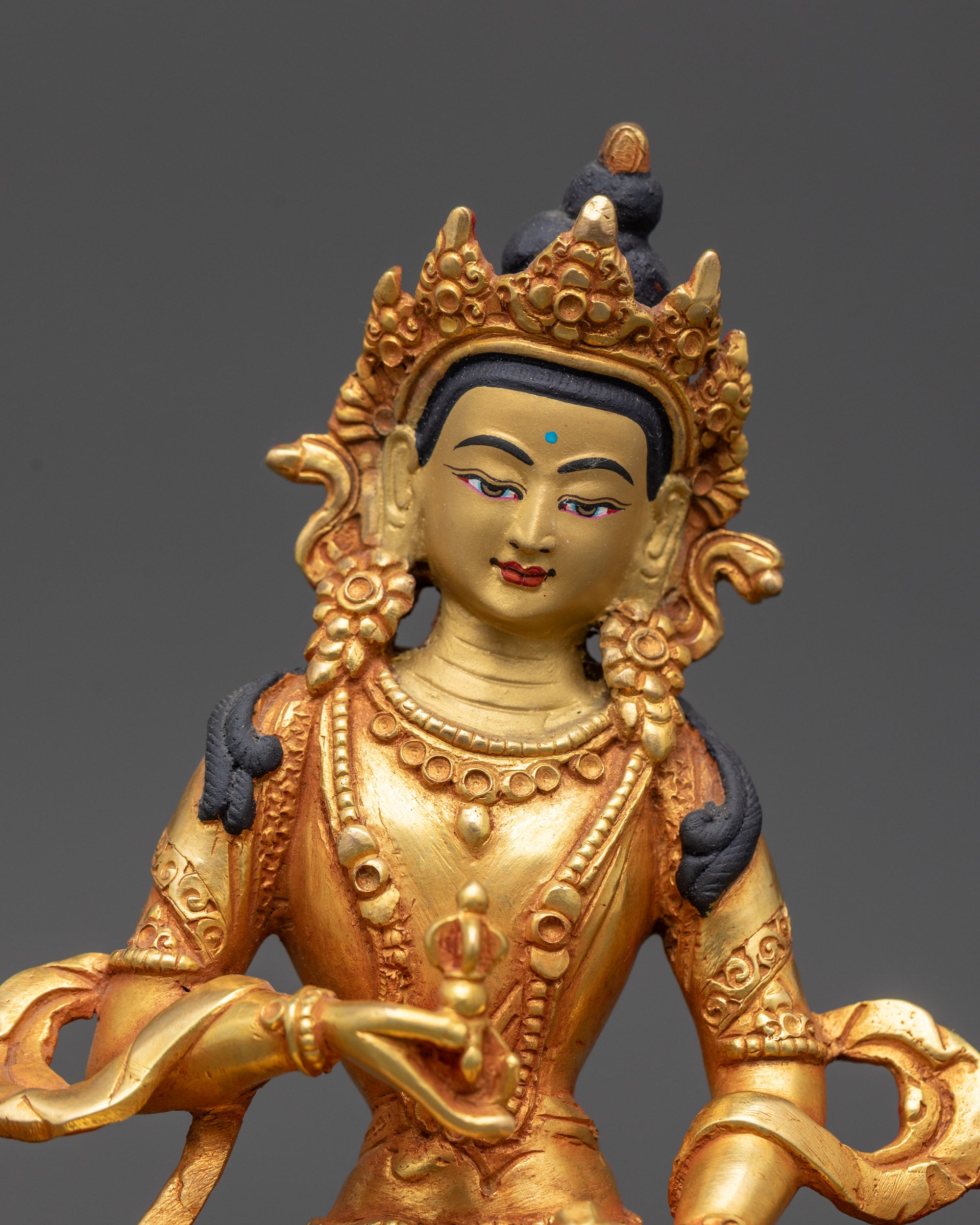 Close up of Dorje Sempa Vajrasattva statue highlighting crown and intricate jewelry