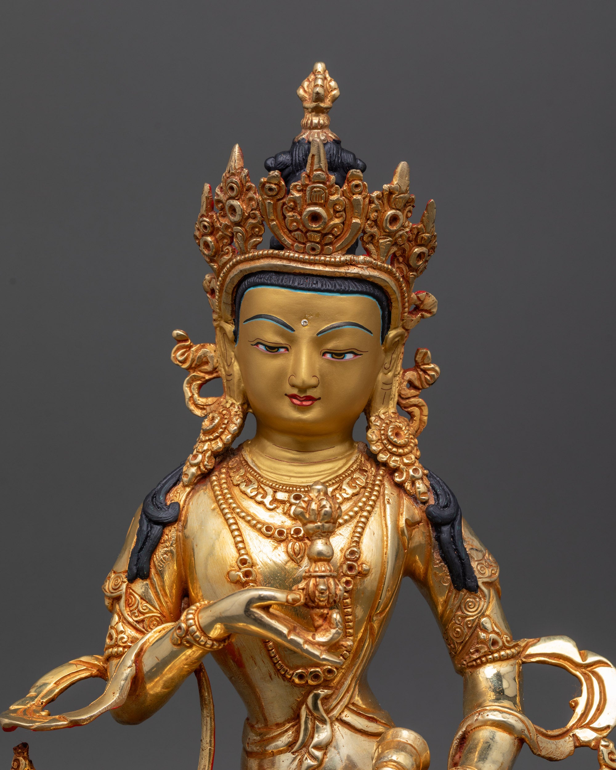 Close up of Dorje Sempa statue showing intricate lower garment adorned with semi-precious stones