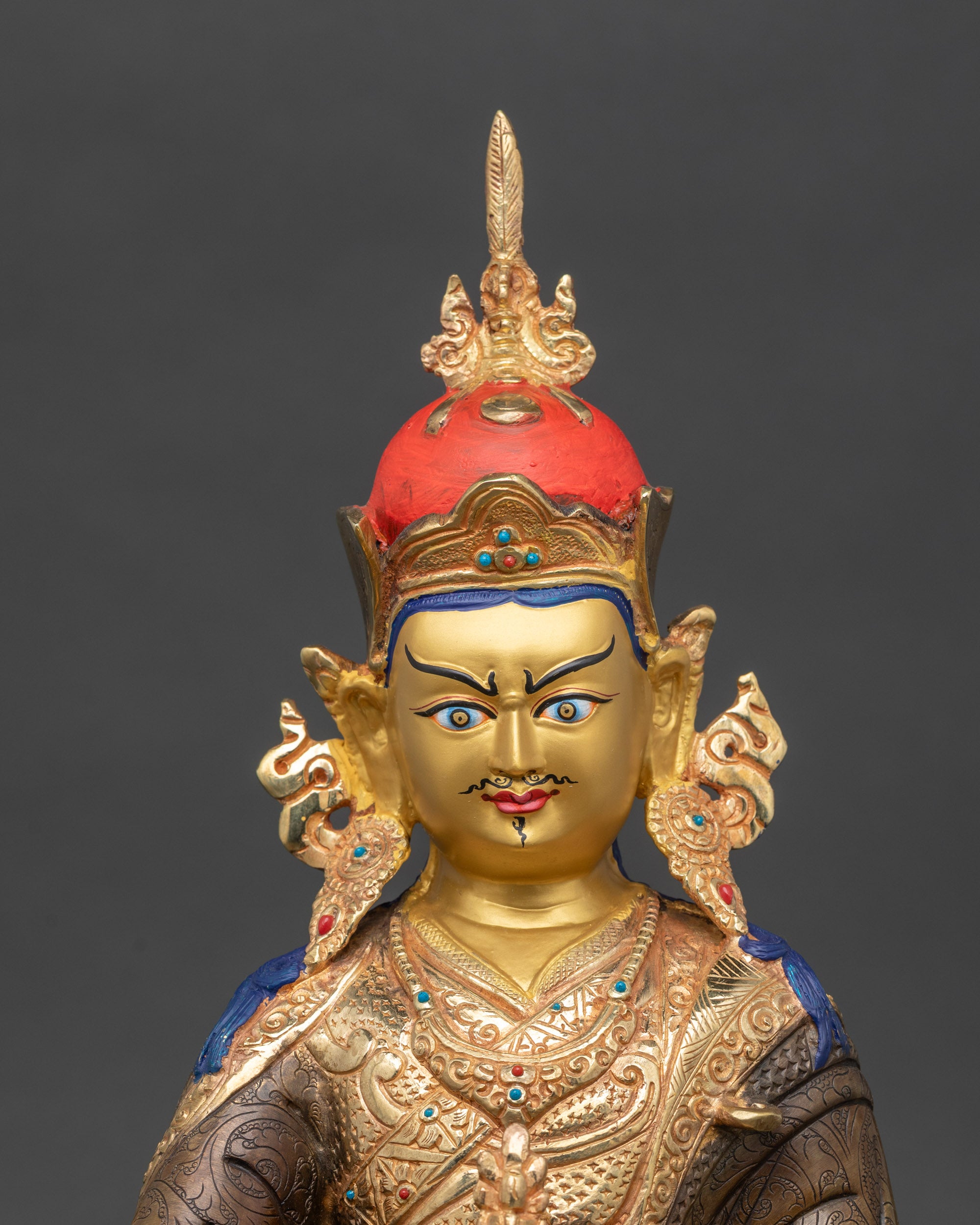 Close up of Guru Rinpoche holding vajra and kalash | handcrafted Nepalese copper statue