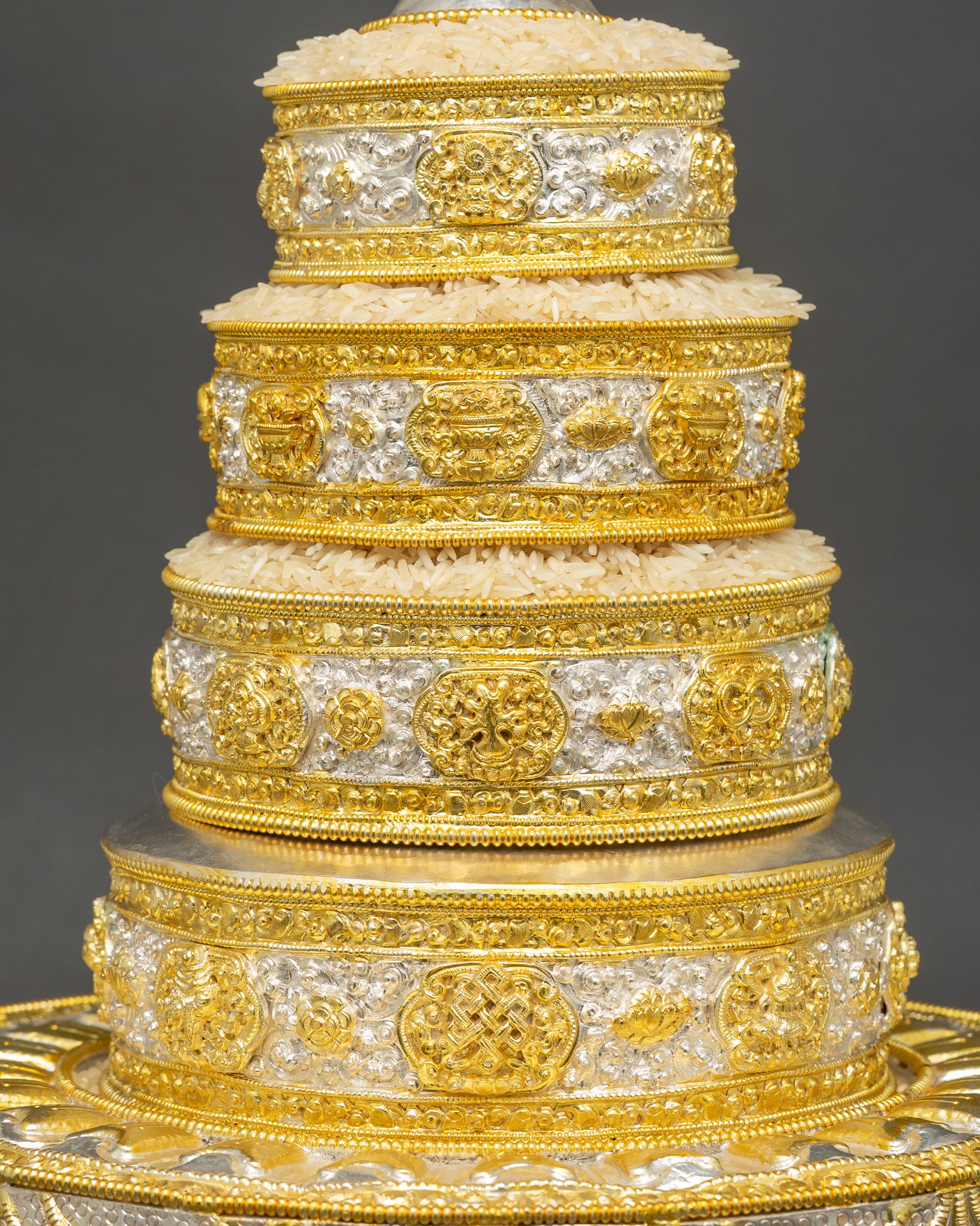 Close up of Himalayan handcrafted mandala showing intricate filigree and gold-plated details