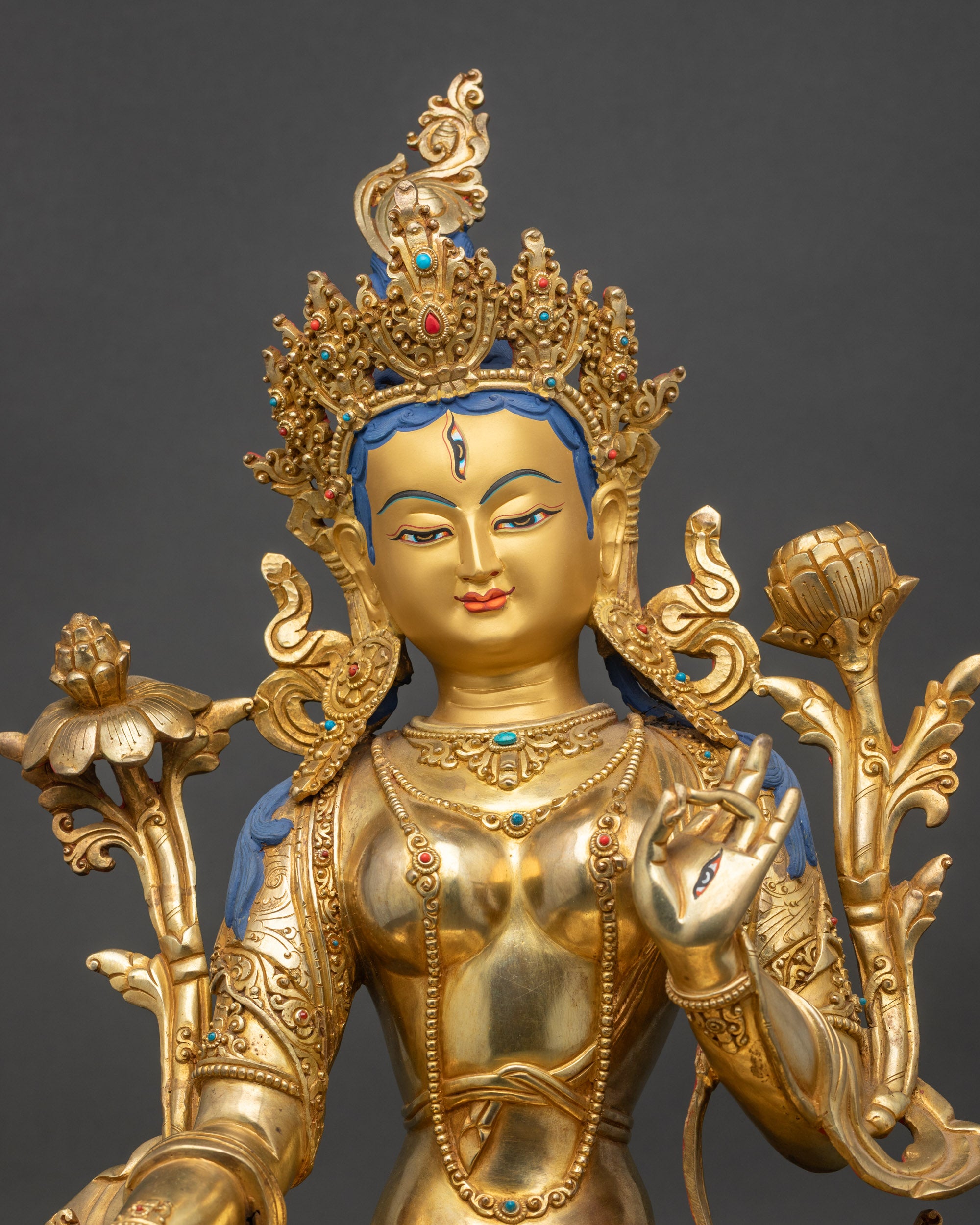 Close up of White Taraβs serene face, Five-Jeweled Crown, and seven seeing eyes