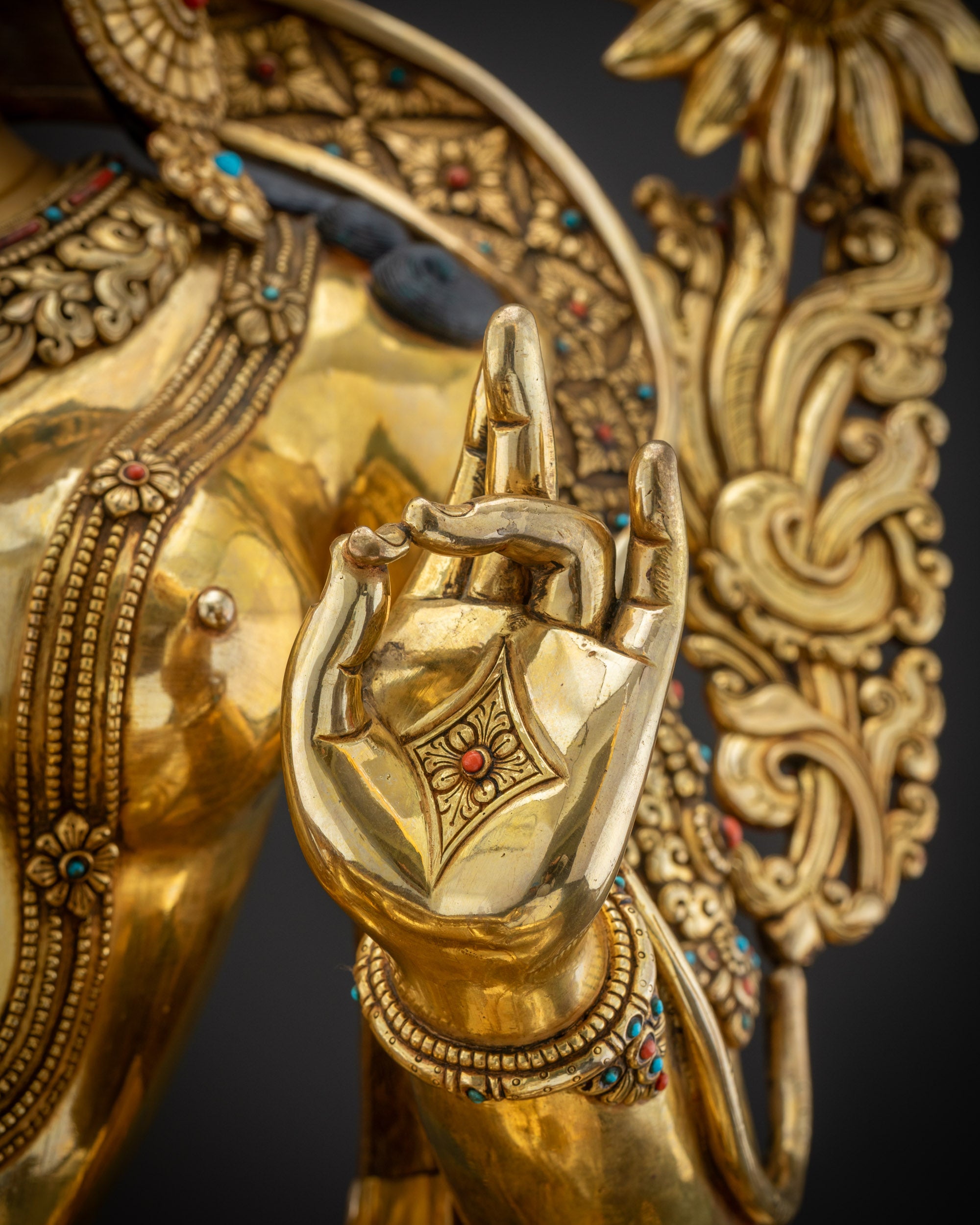 Close up of statue Abhaya Mudra left Green Tara left hand Abhaya Mudra protector deity