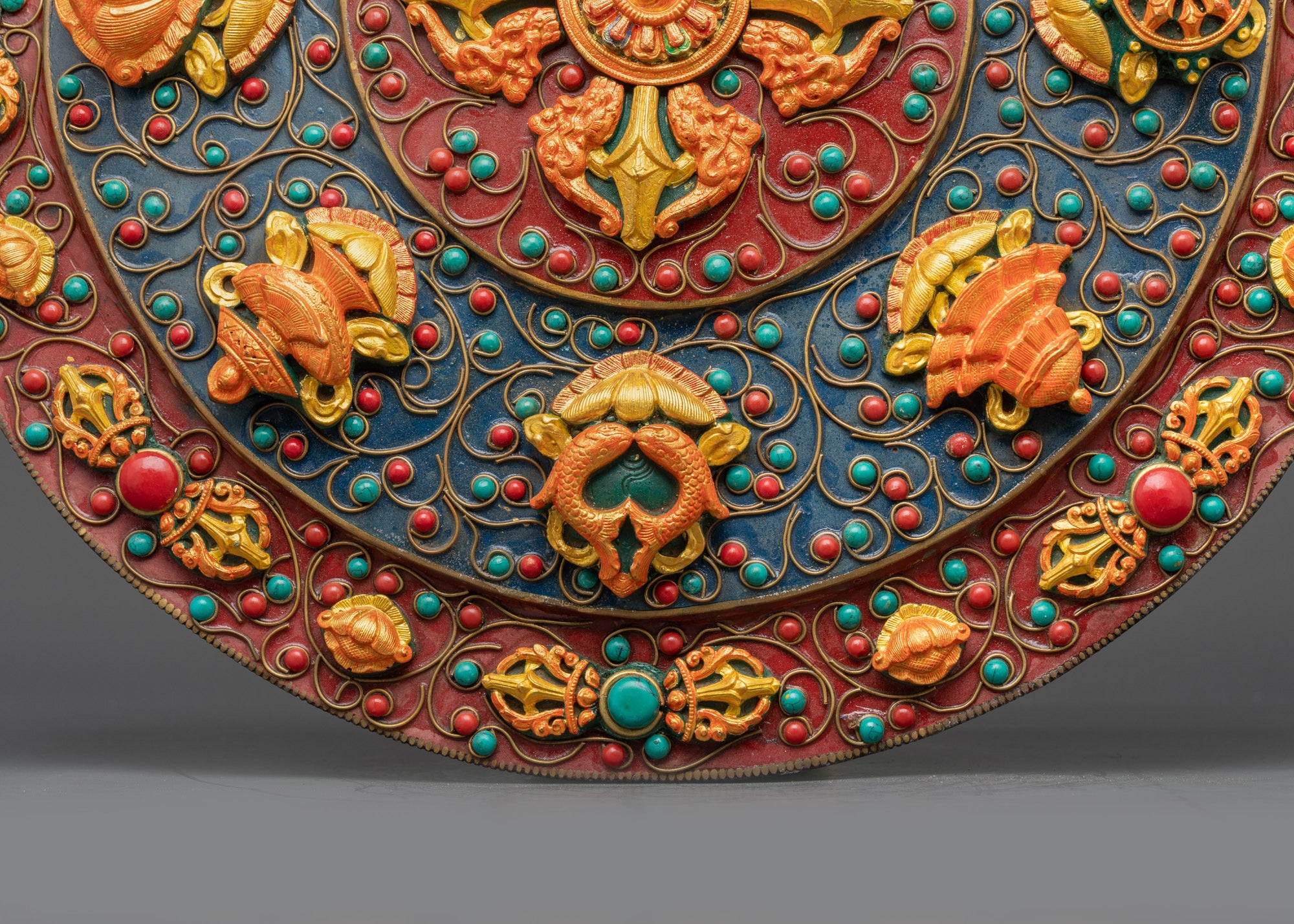 Close up outer ring Vajra symbols with gold-plated filigree design on Mandala wall art