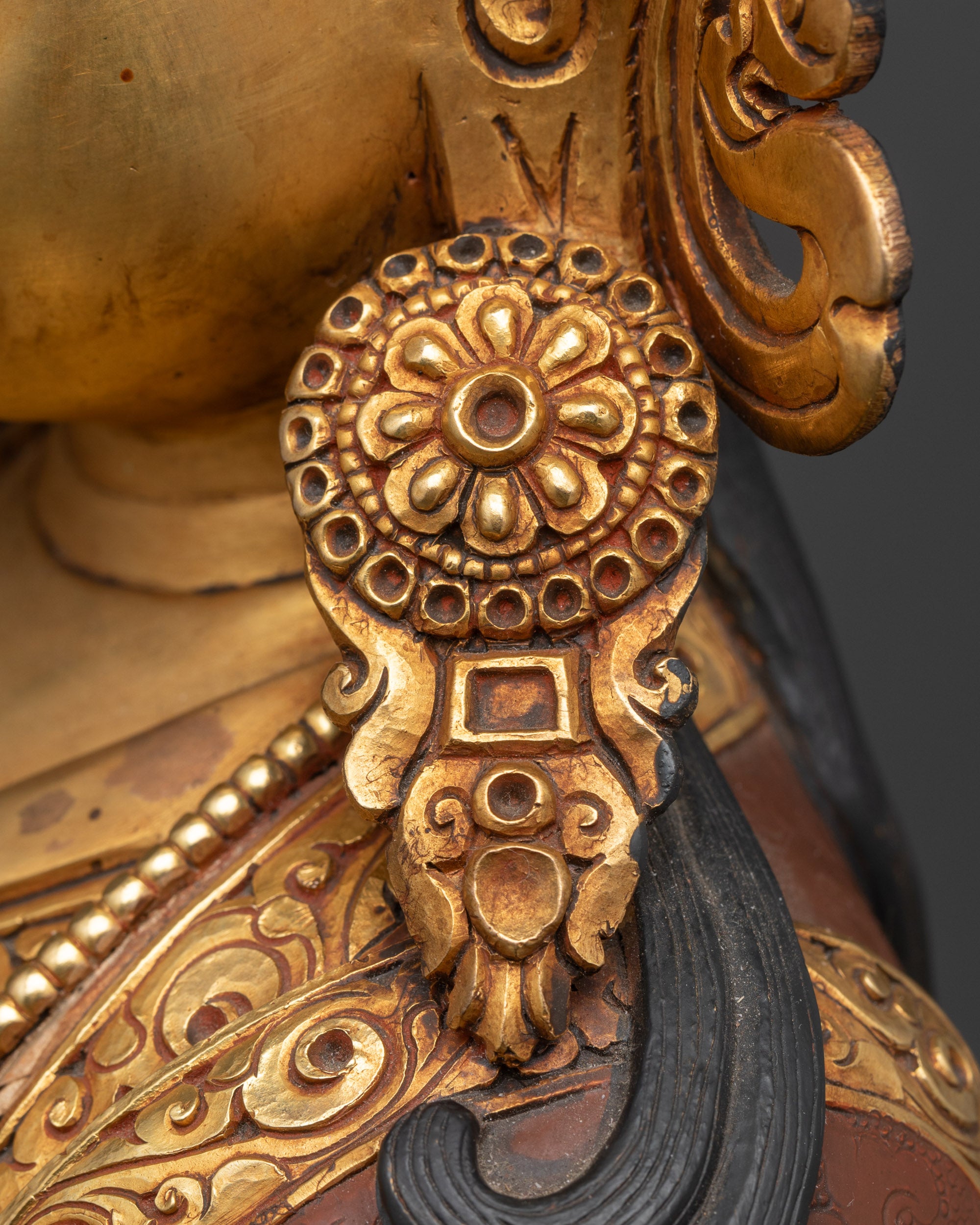 Close up side angle of Guru Rinpoche crown, earrings, and ornate jewelry with rich acrylic colors