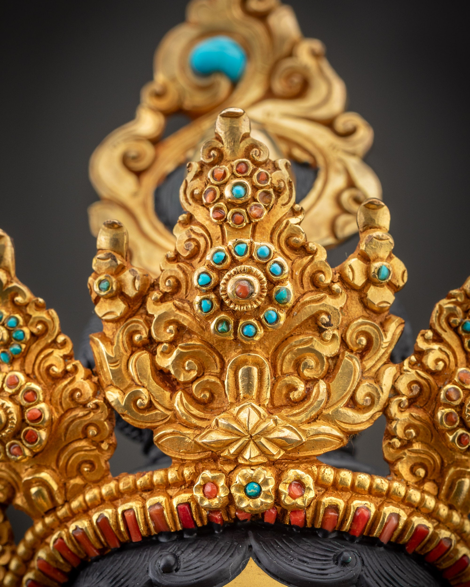 Close up view of Green Tara jewelry including crown and chest ornaments