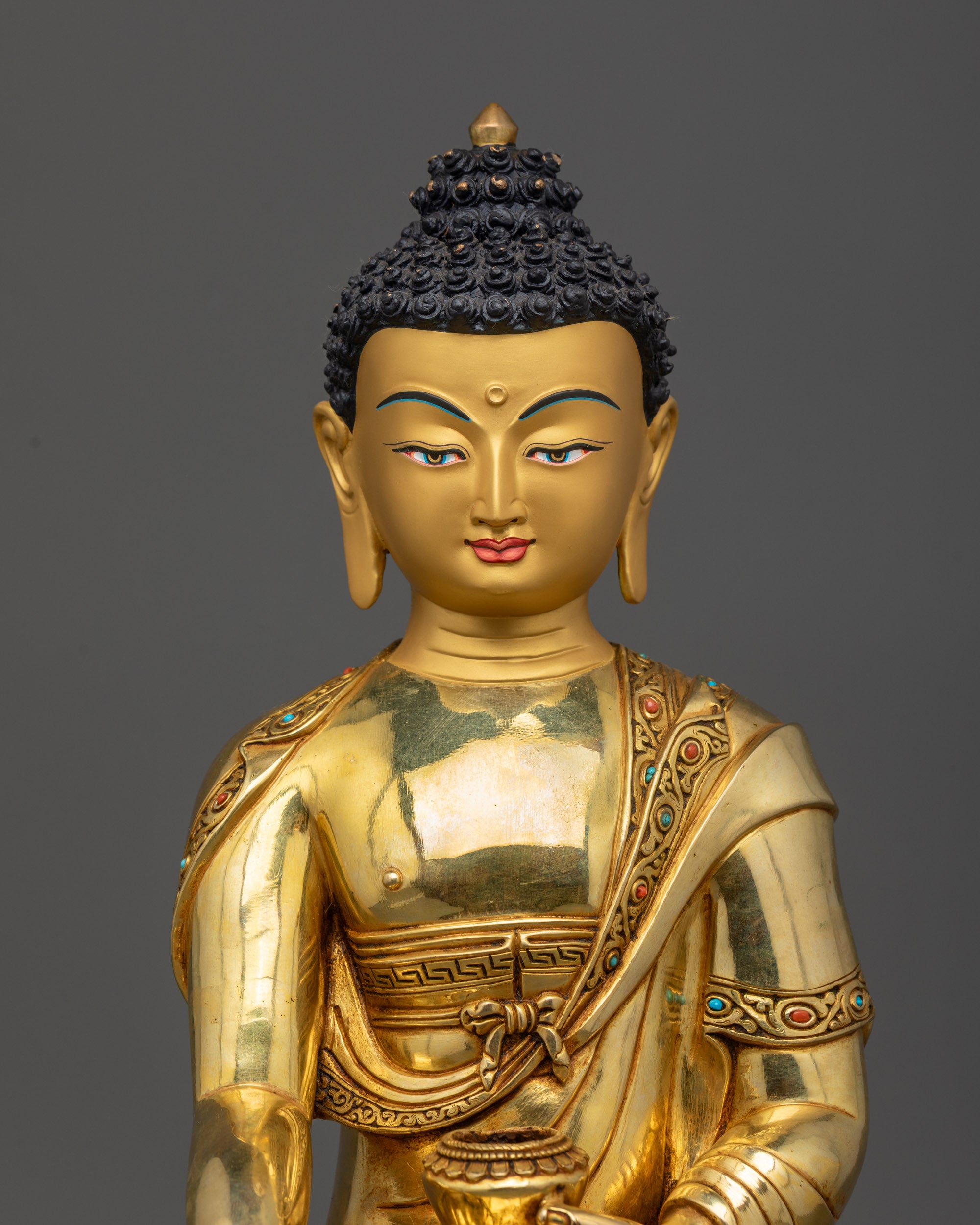 Close up half-body view of fire-gilded Shakyamuni Buddha holding alms bowl