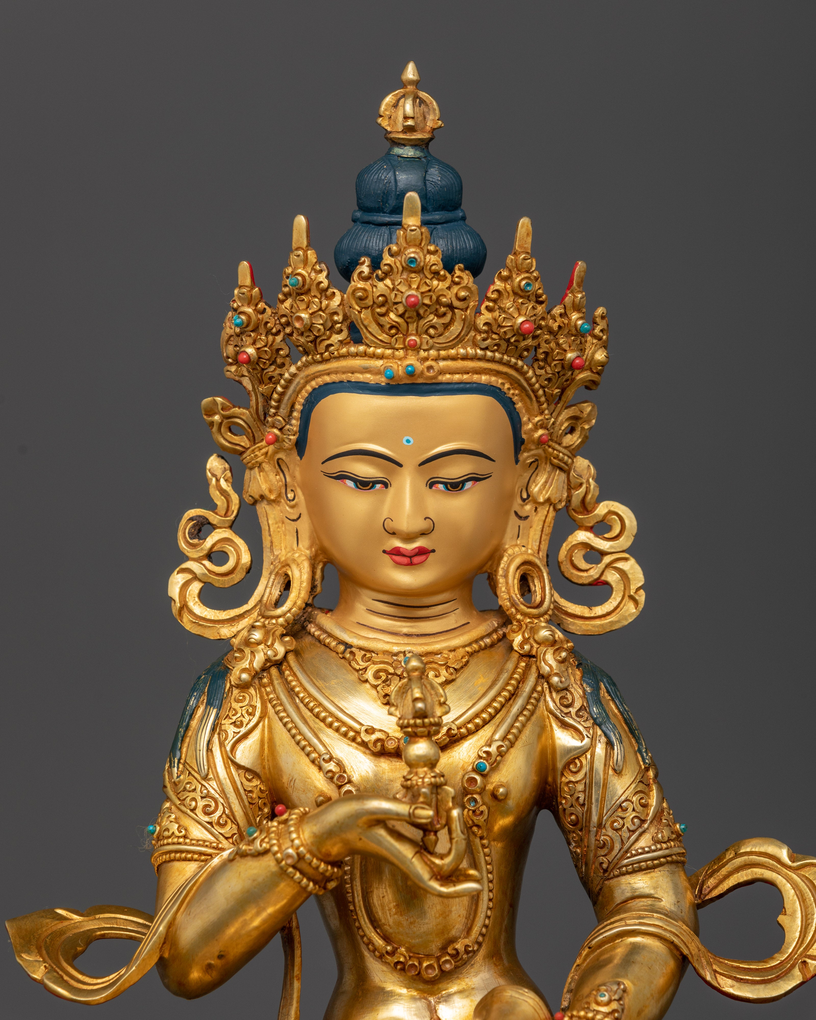 Close view of Vajrasattva deity with 24K gold face and intricate fire gilded details