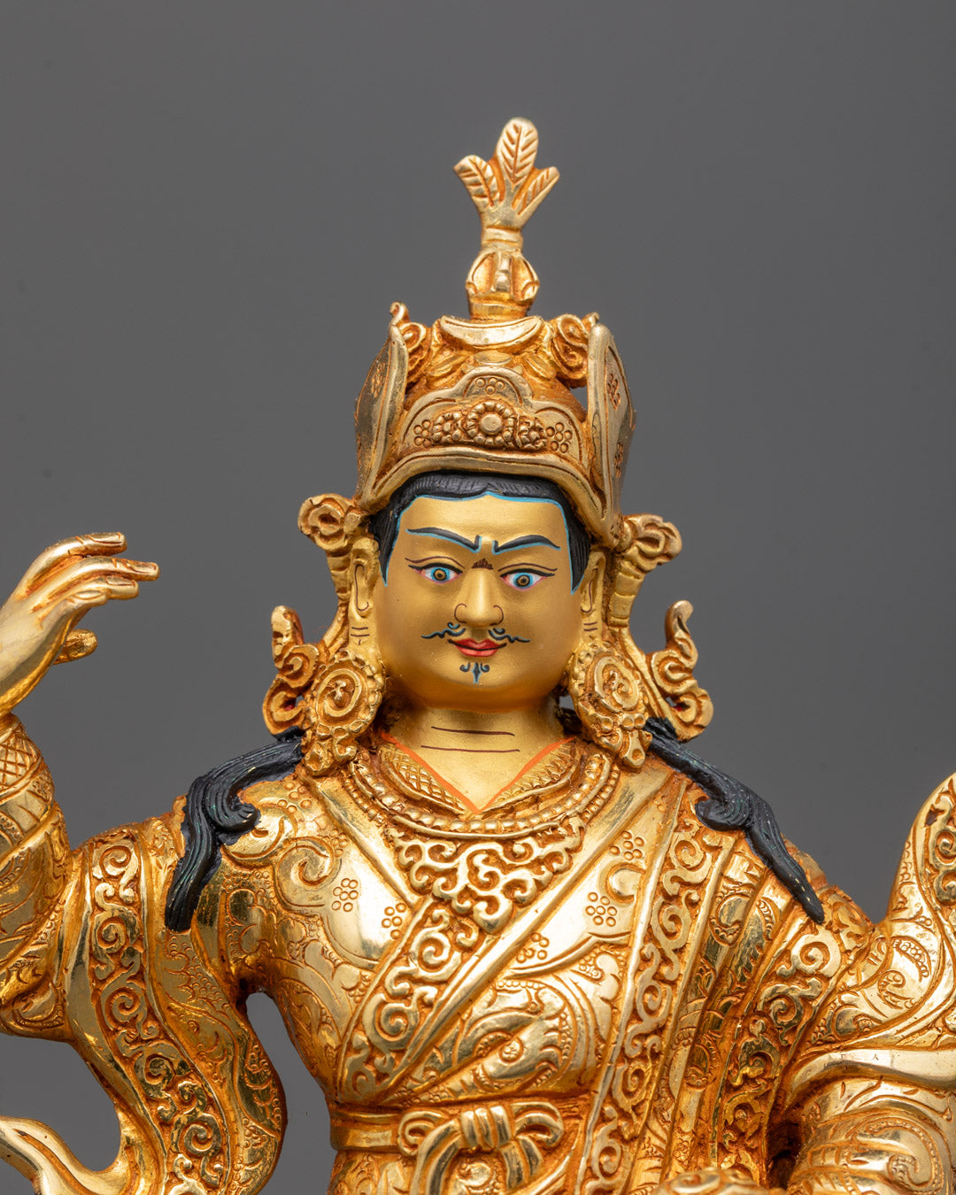 Closeup of Guru Rinpoche statue’s intricate crown and hand-carved jewelry details
