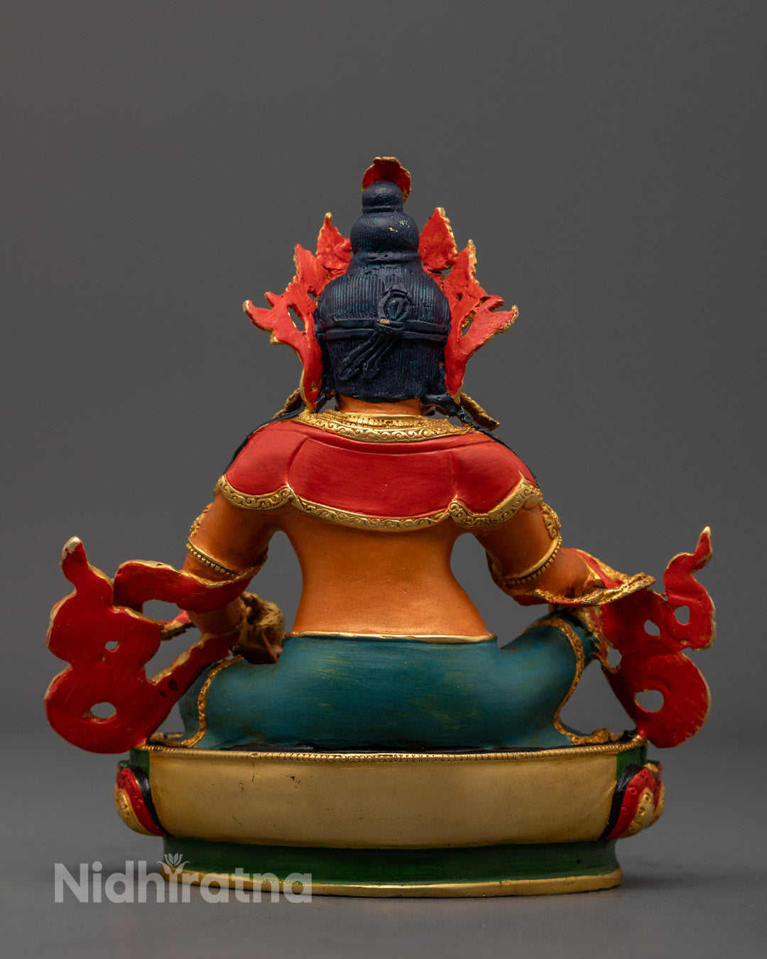 Decorative Dzambhala statue placed on a meditation altar, glowing with spiritual energy and blessings of abundance.
