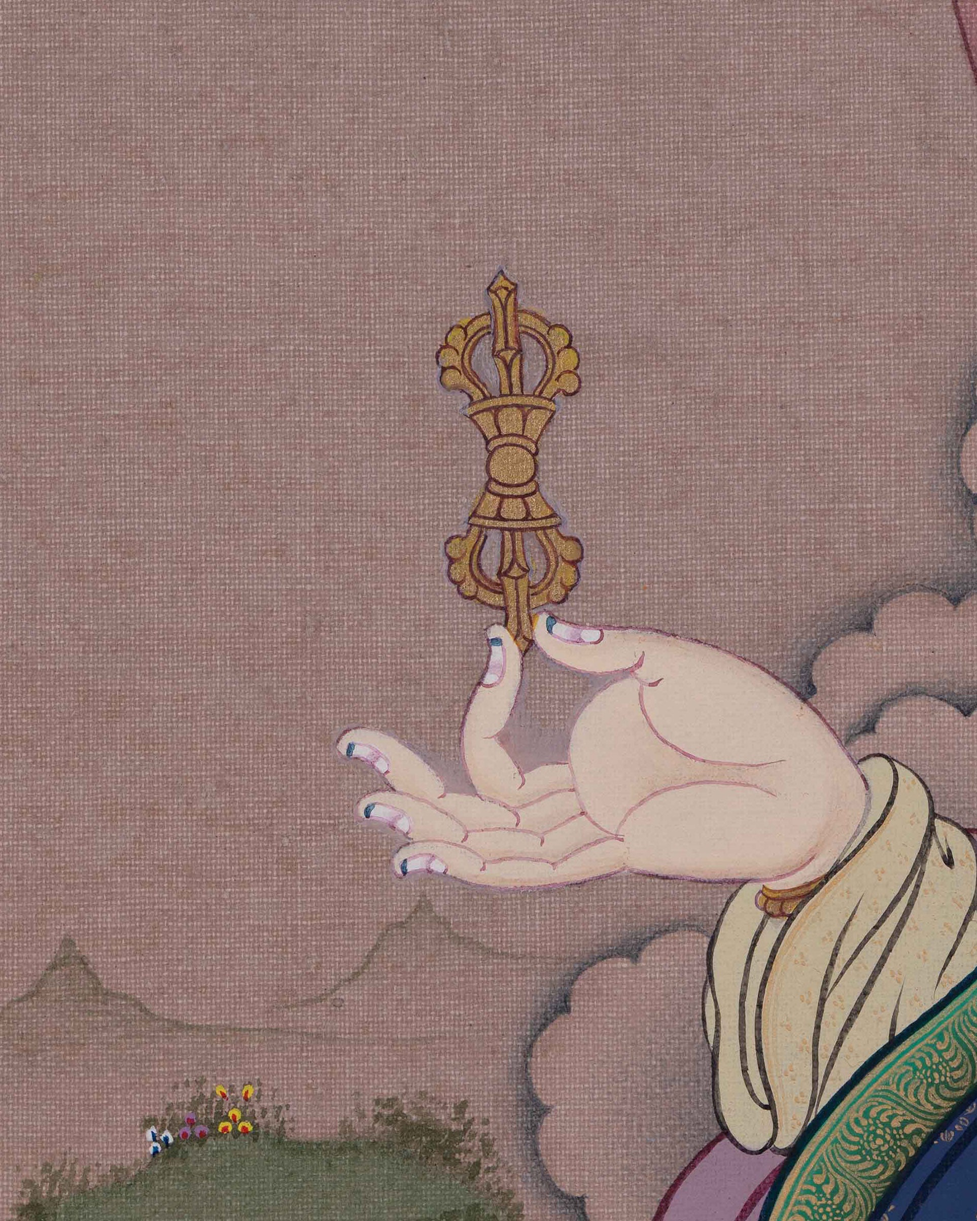 Detail of Guru Rinpoche's hands holding the symbolic dorje and tantric khatvanga staff.