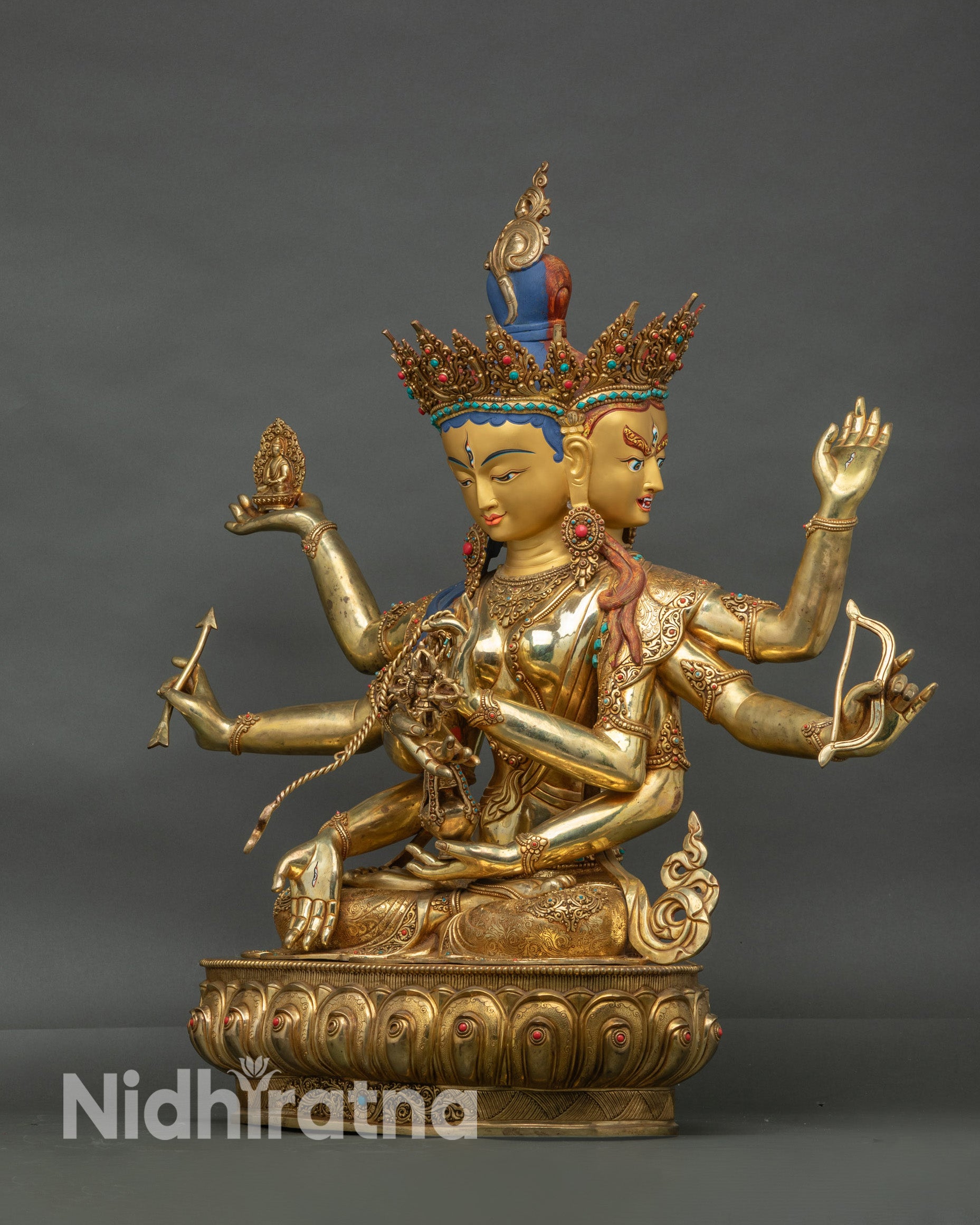 Detail of floral motifs and gold-plated robes on Namgyalma Tibetan Dakini statue