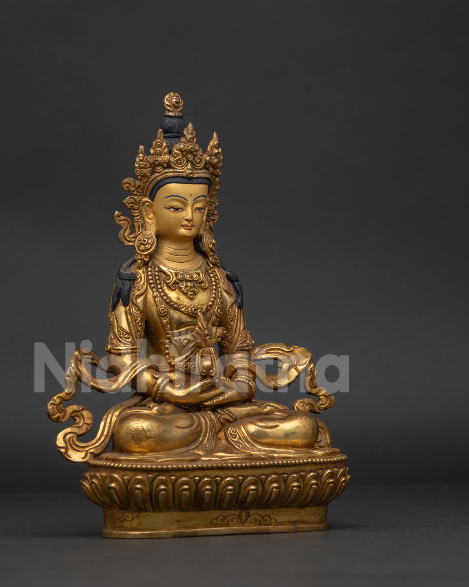 Detailed Amitayus statue with five jewel crown and ritual silk motifs.