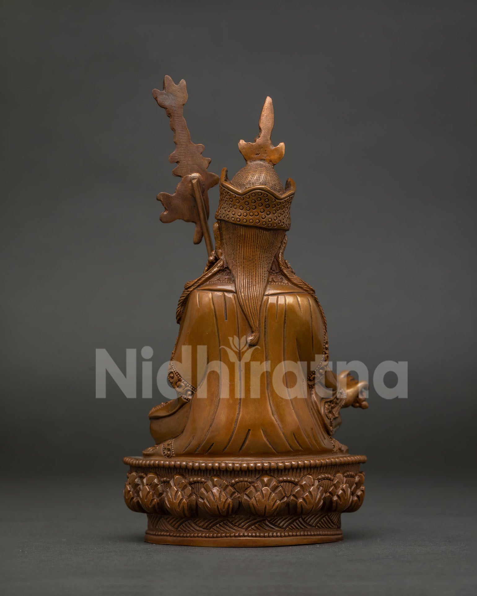Detailed back view of Guru Rinpoche statue showcasing hand carved lotus pedestal and Newari craftsmanship.